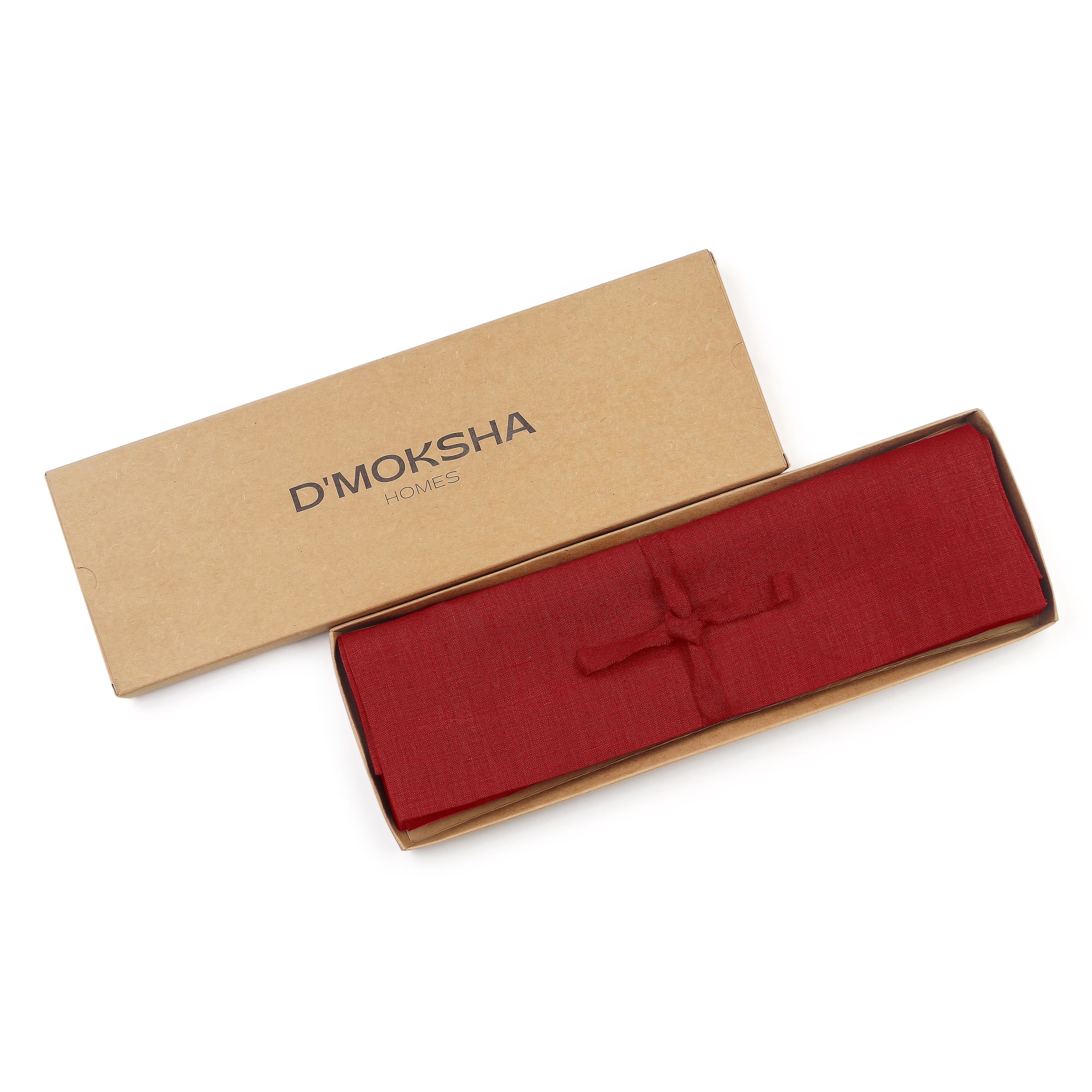 Red linen placemats folded to show fabric texture