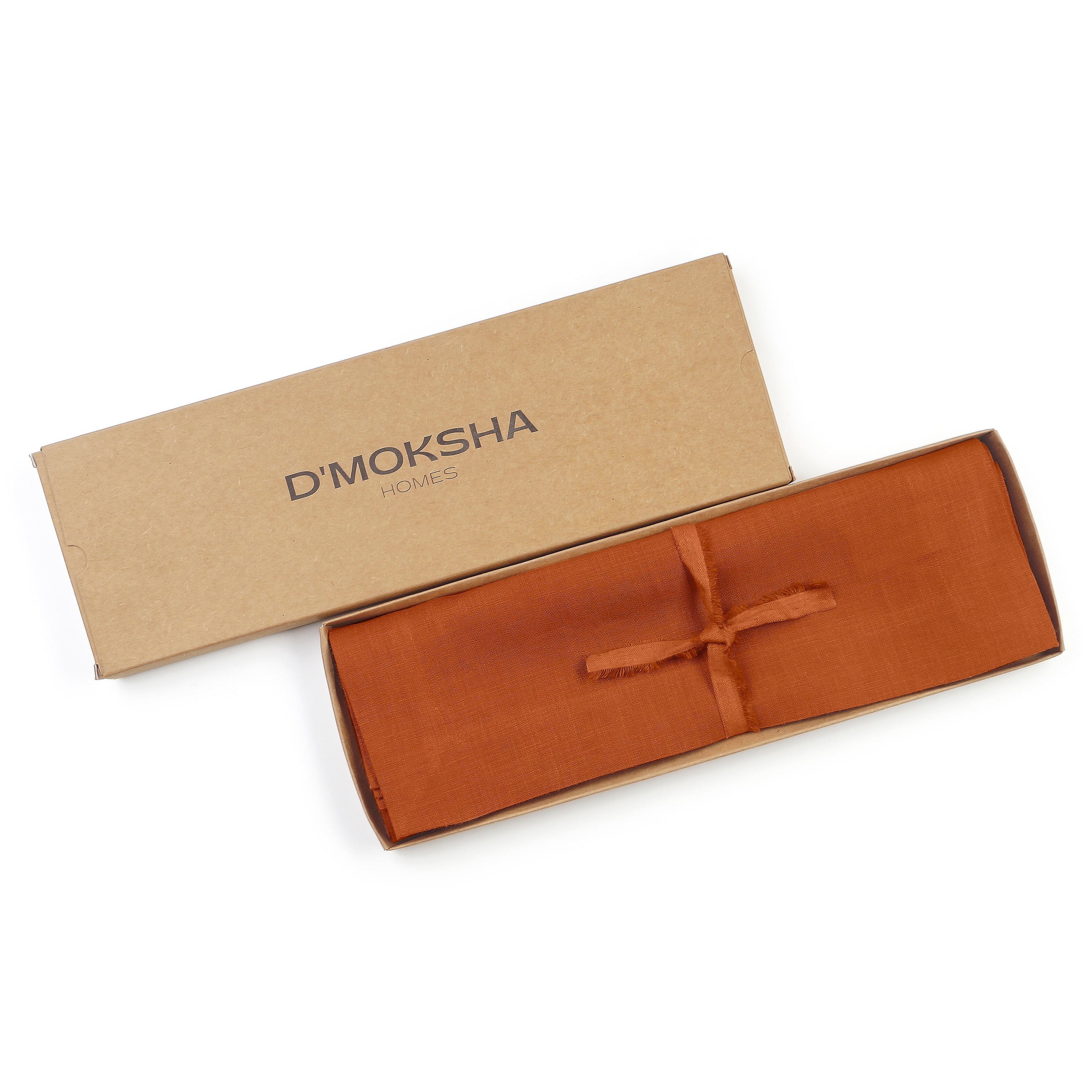 Rust linen placemats folded to show fabric texture