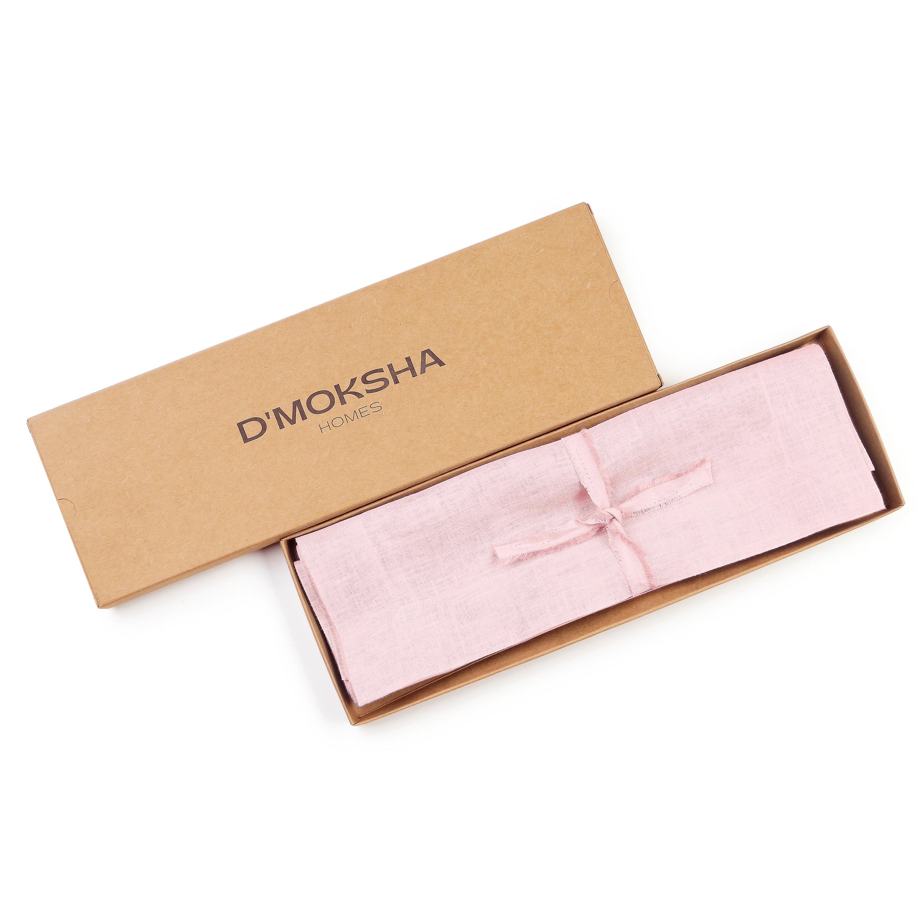 Pastel pink linen placemats folded to show fabric texture