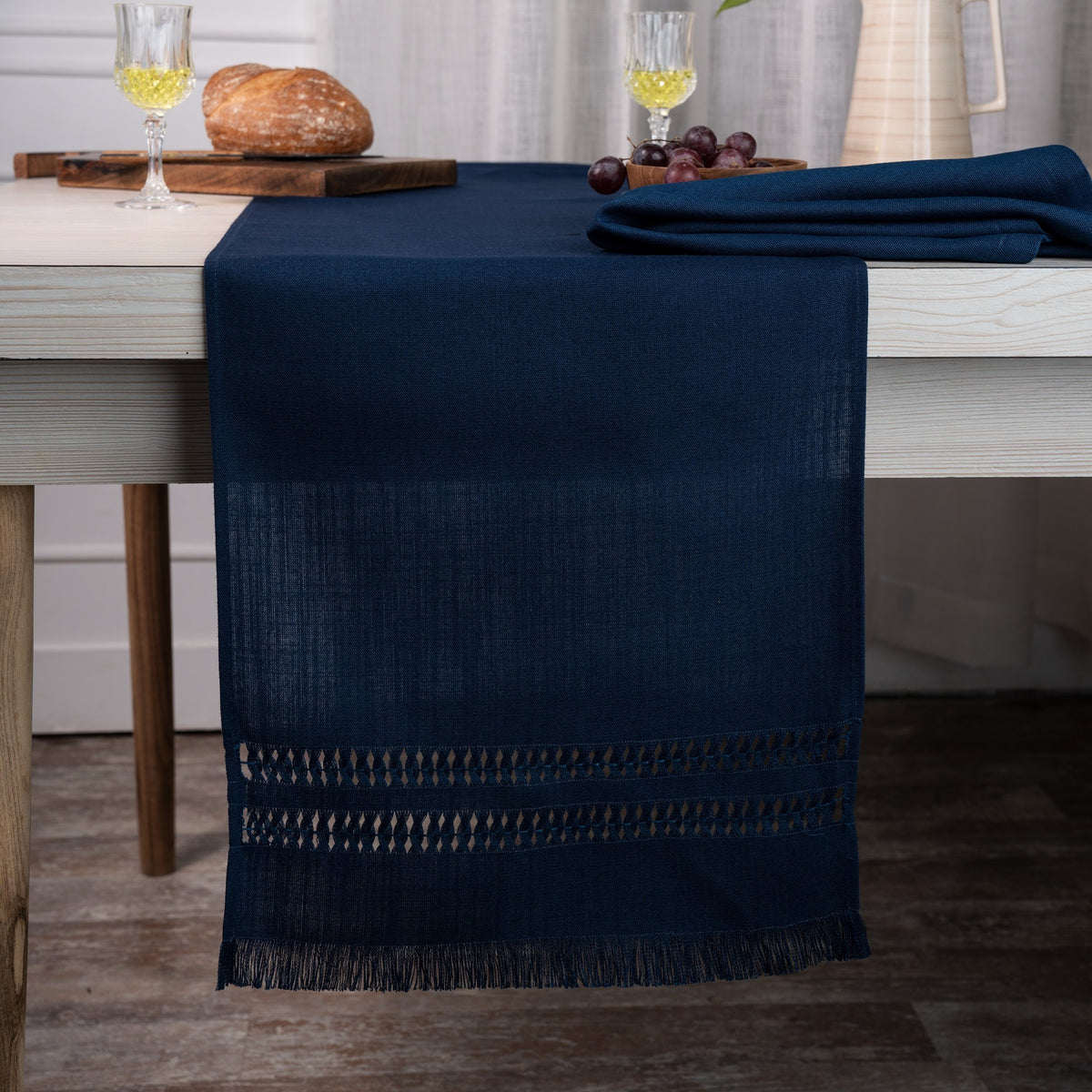 Navy blue faux linen table runner styled on a dining table
