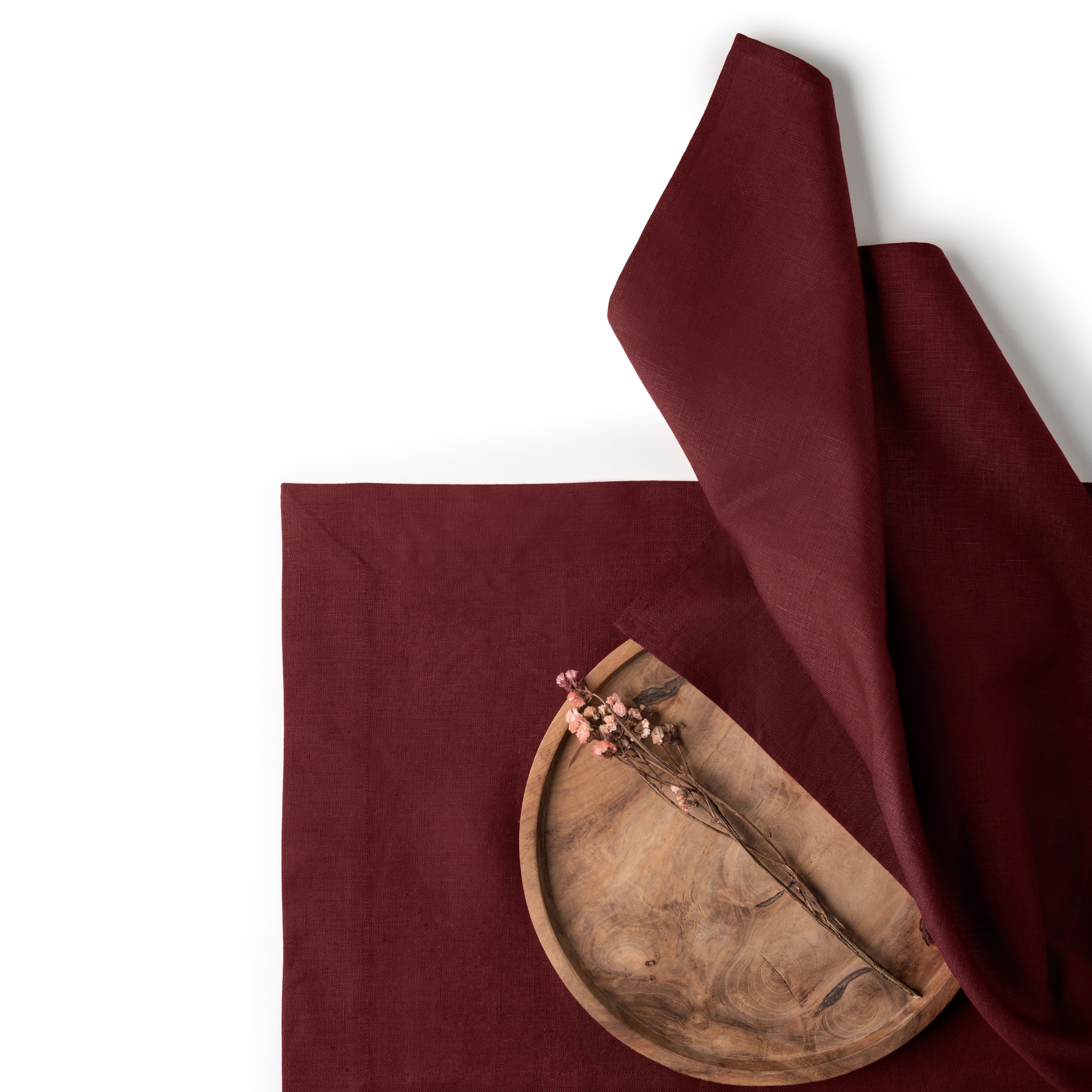 Dark red pure linen dinner napkins styled on a dining table