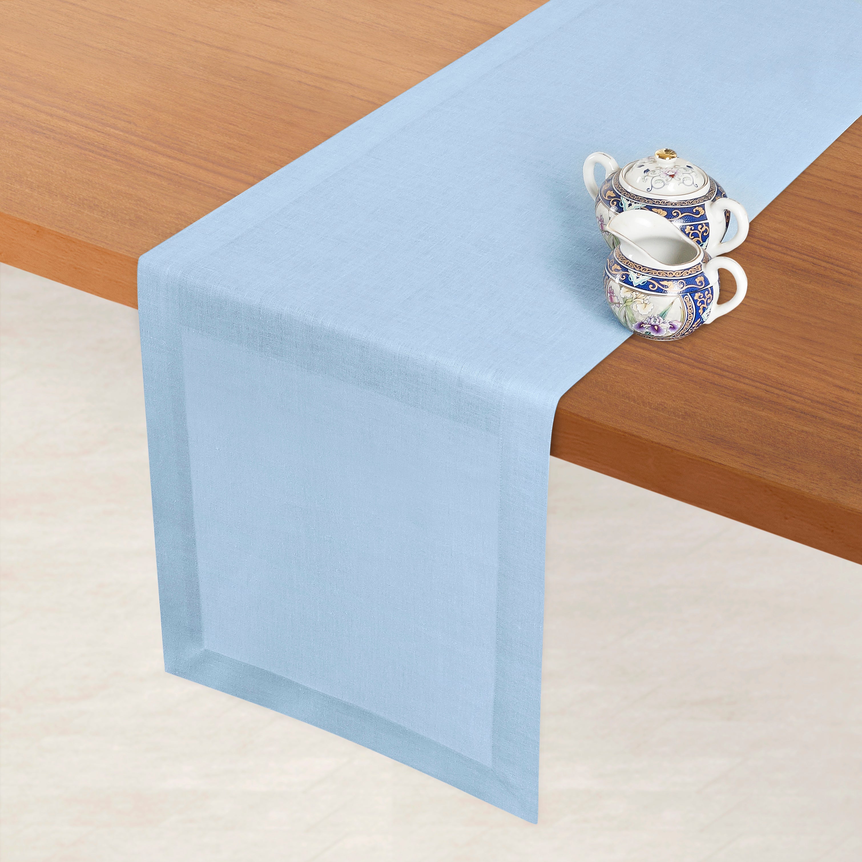 Powder blue pure linen table runner styled on a dining table