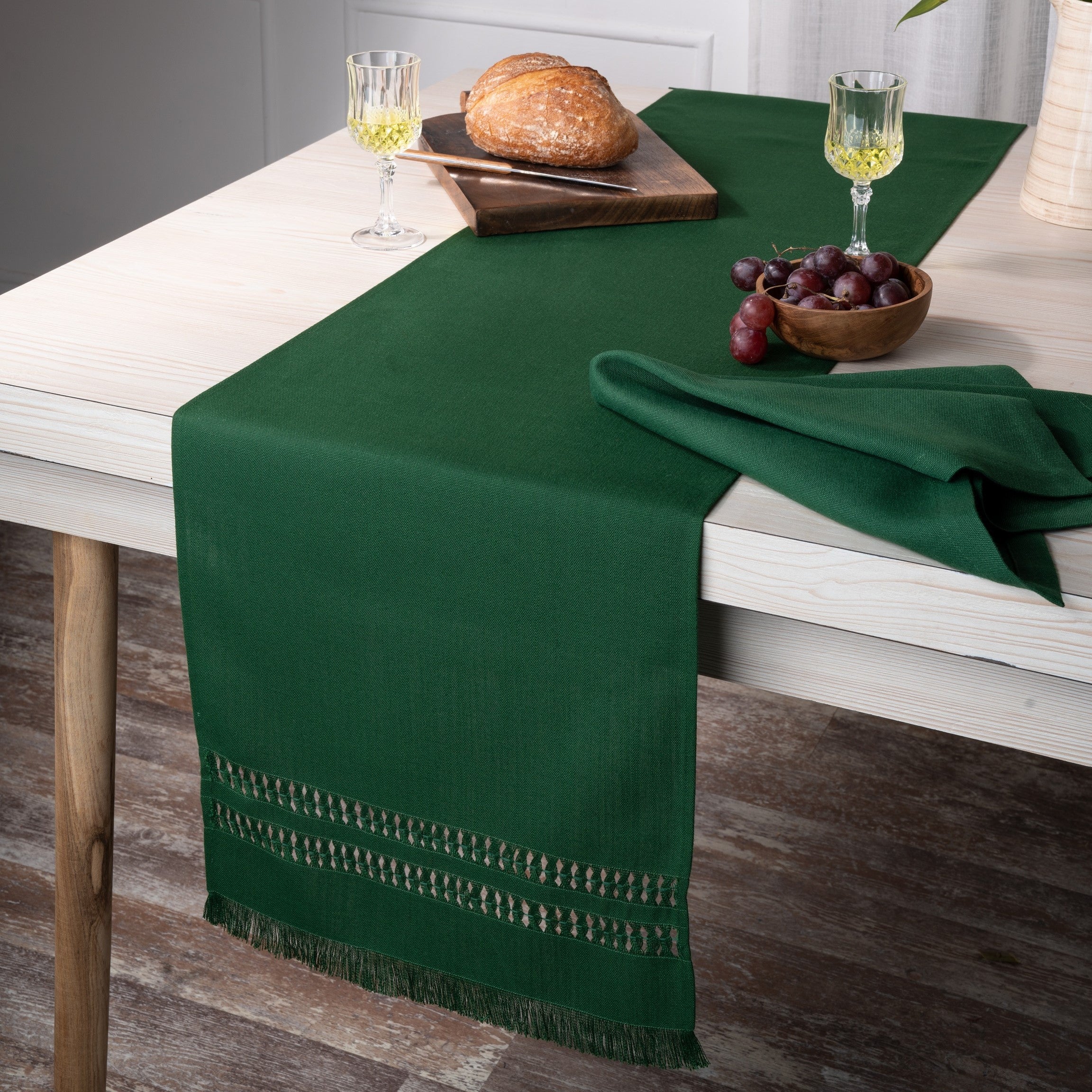 Close-up of the hand-hemstitch edge on an eden green faux linen table runner