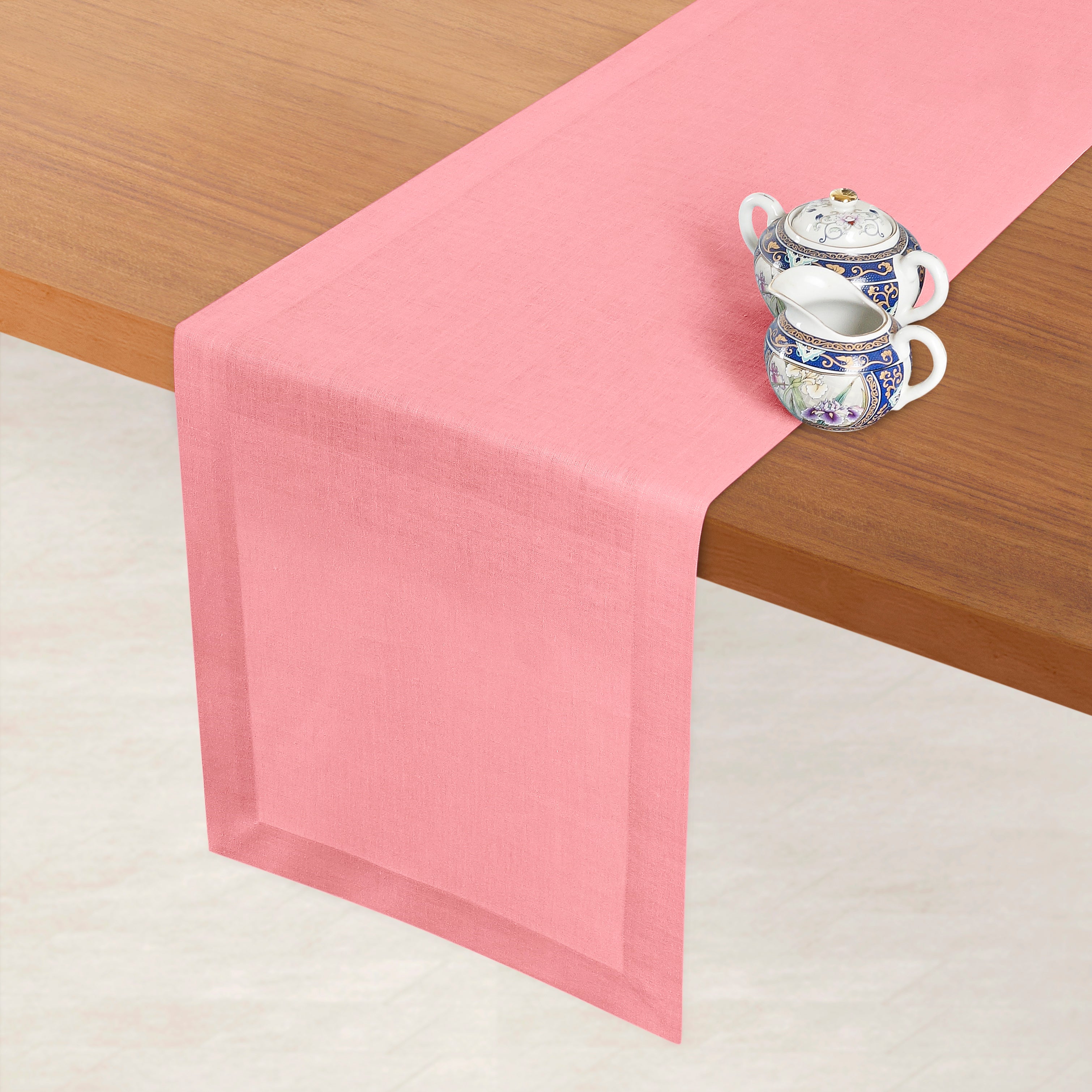 Dusty pink pure linen table runner styled on a dining table