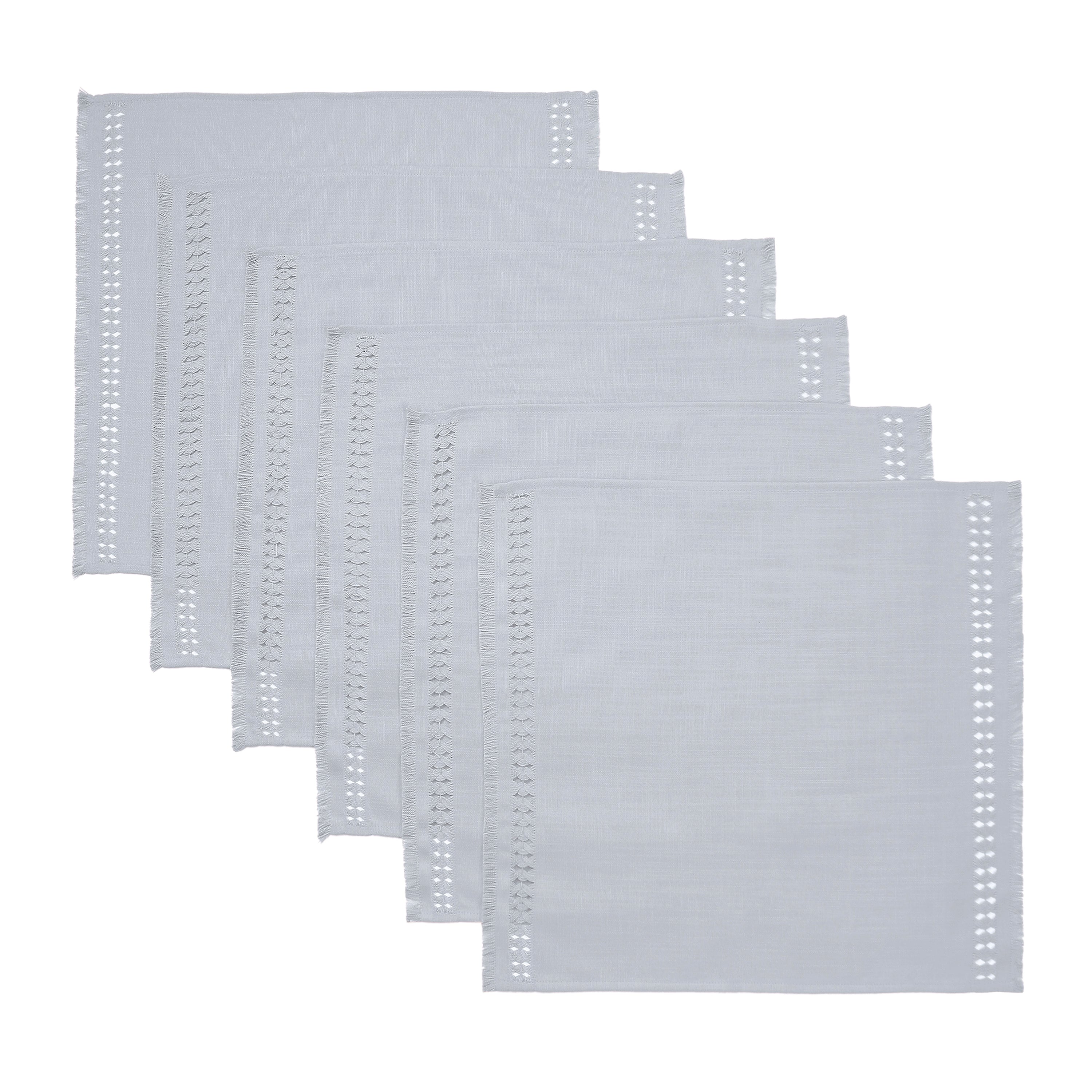 Light grey faux linen dinner napkins styled on a dining table
