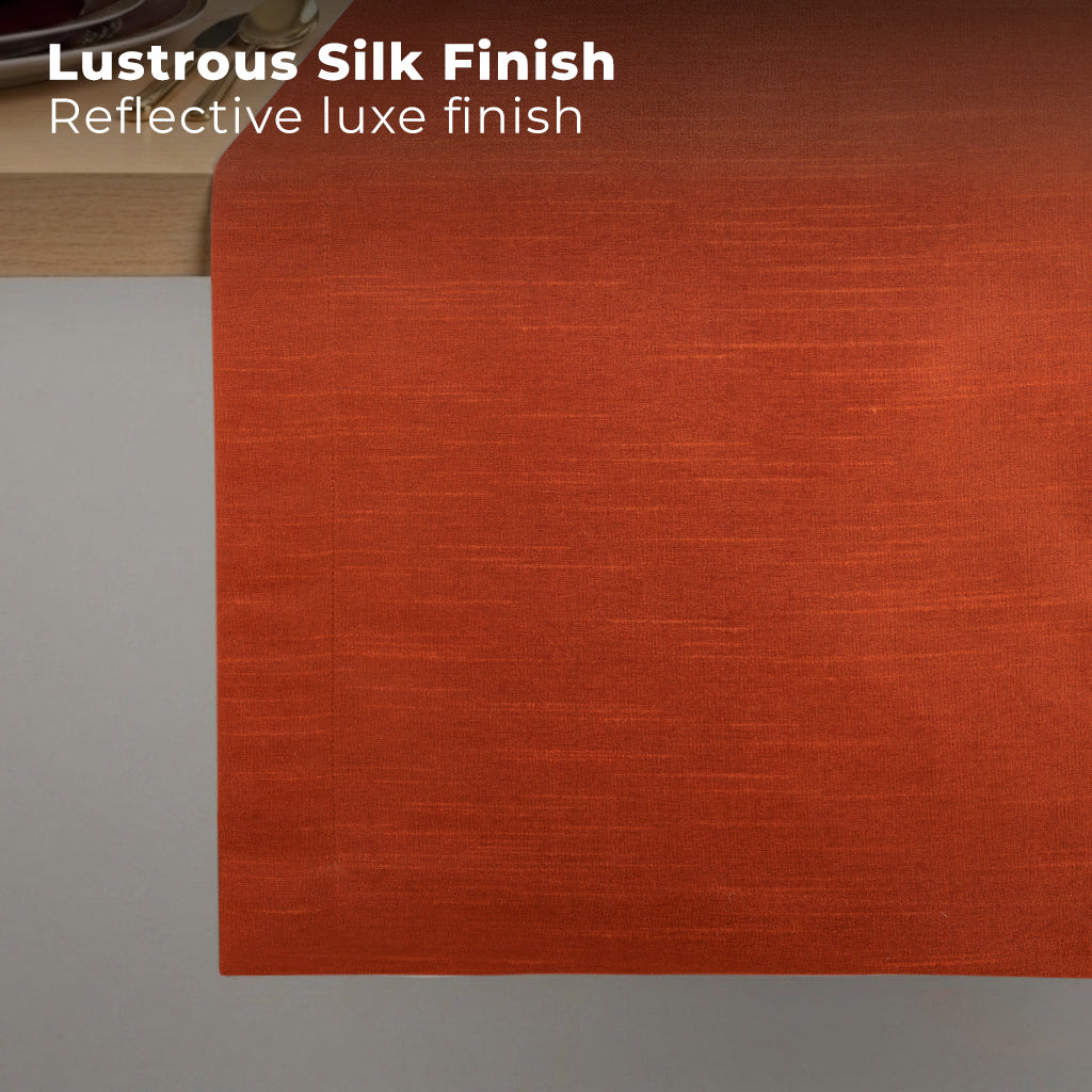 Rust Luxe Shine table runner styled on a dining table