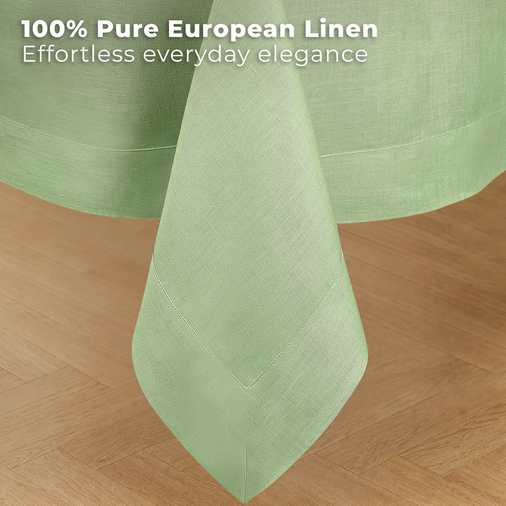Sage green pure linen tablecloth styled on a dining table