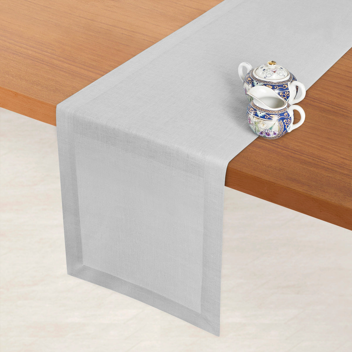 Silver grey linen table runner styled on a dining table