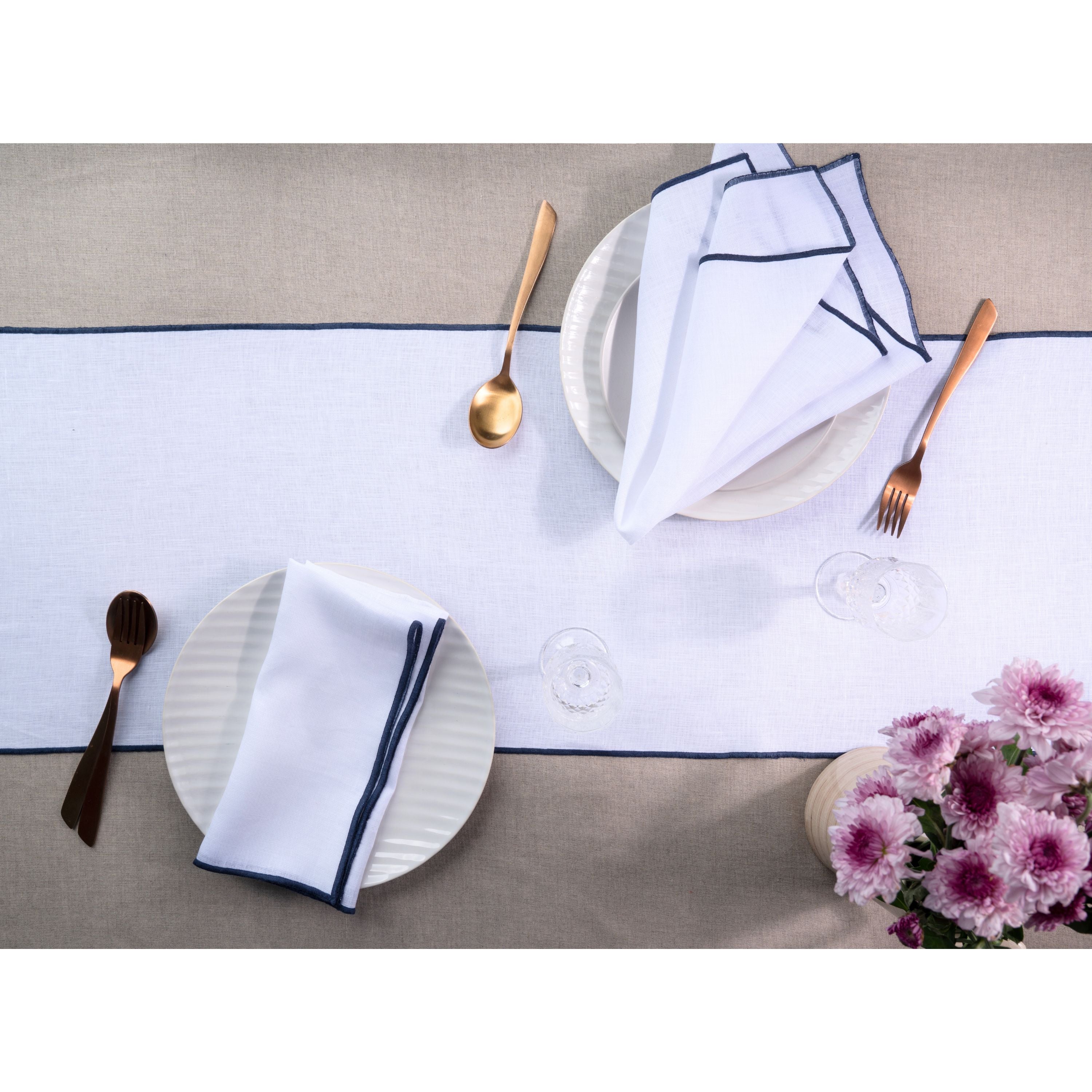 White and navy blue pure linen table runner styled on a dining table