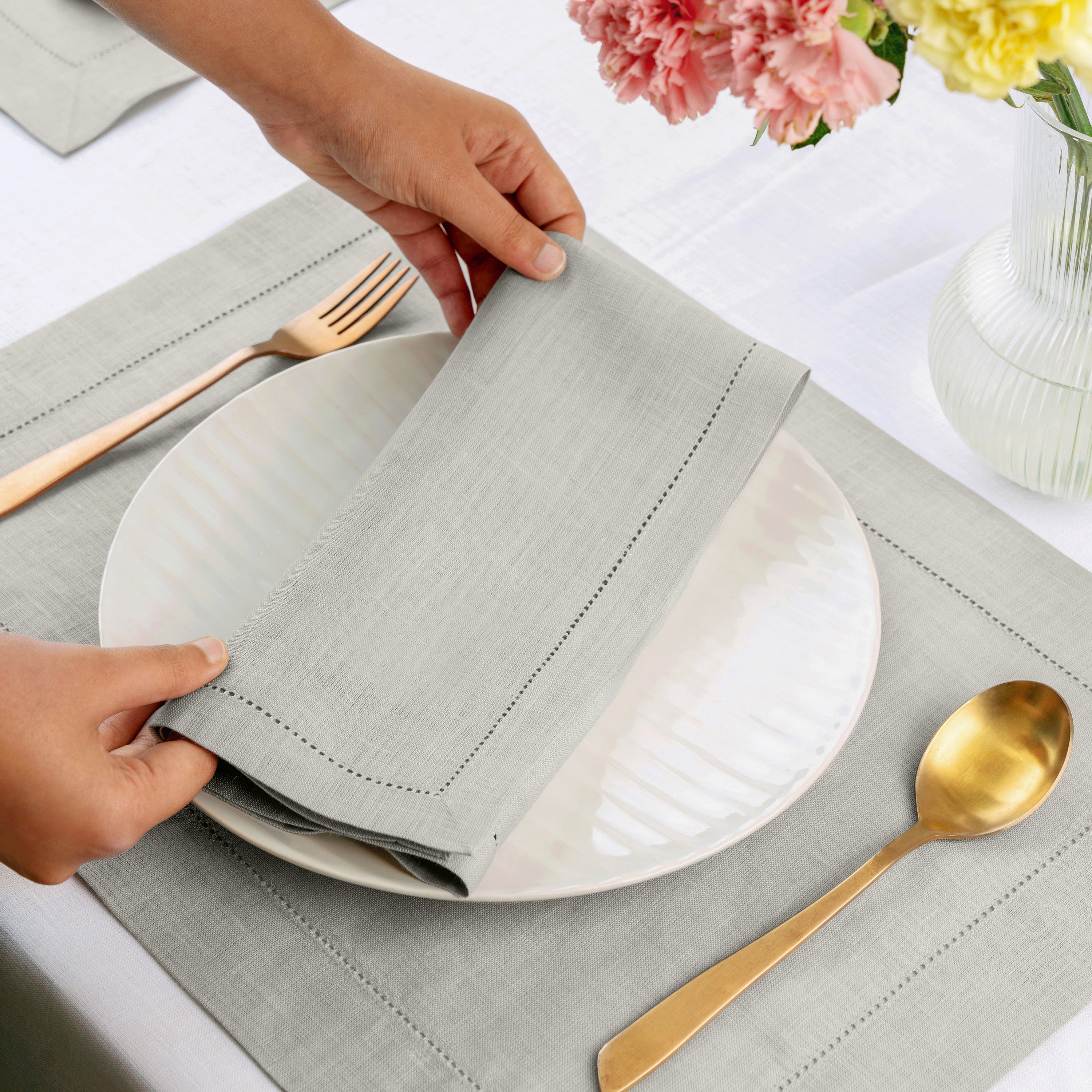Close-up of the hemstitch edge on silver grey pure linen dinner napkins