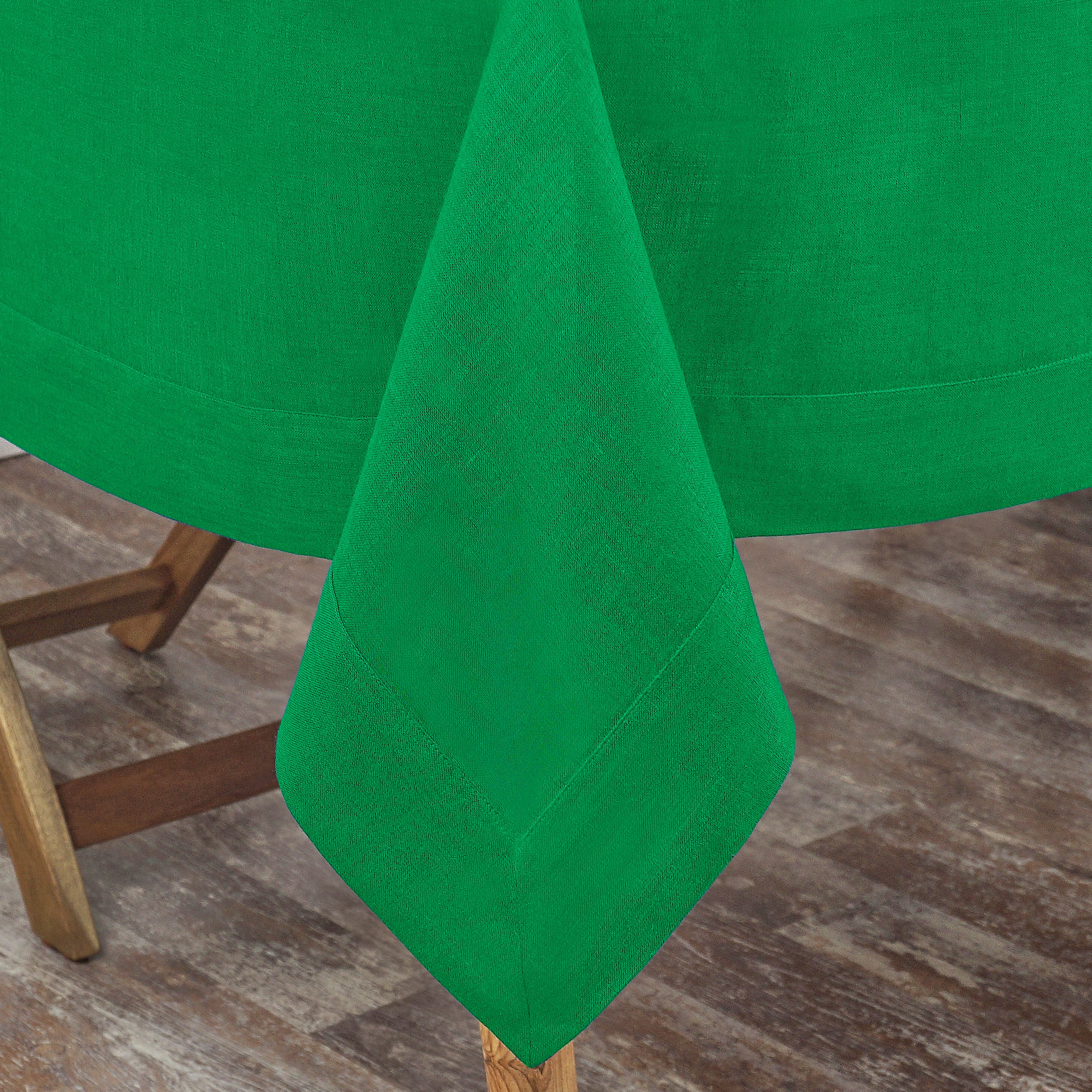 Kelly green pure linen tablecloth styled on a dining table