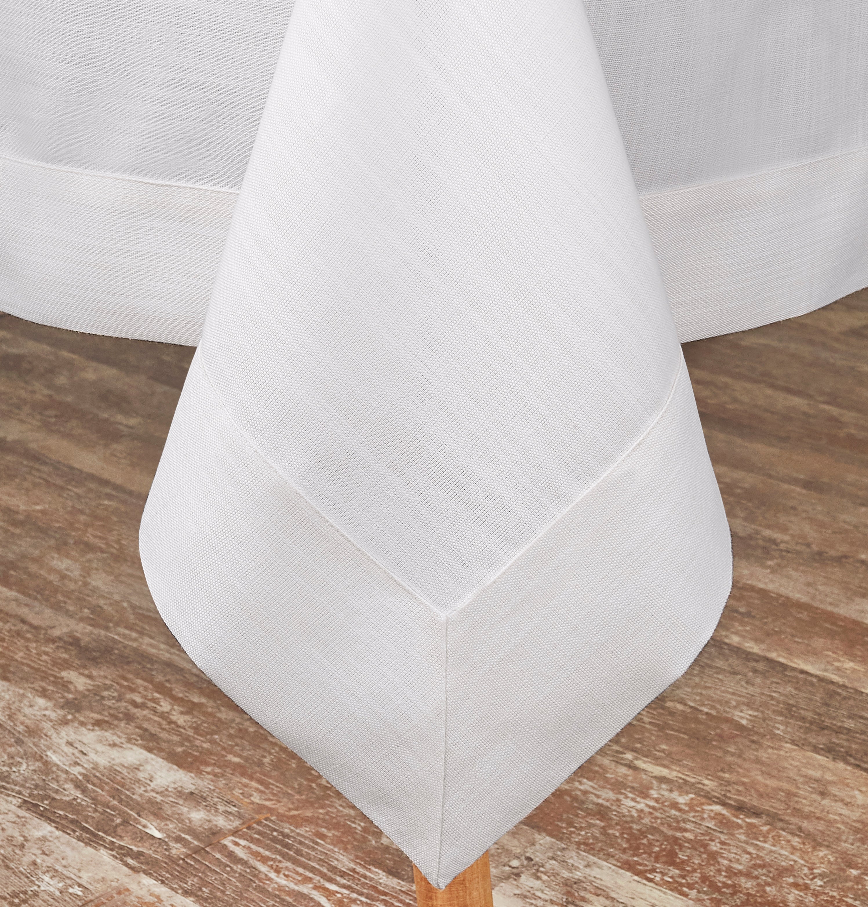 Chambray cream and white faux linen tablecloth styled on a dining table