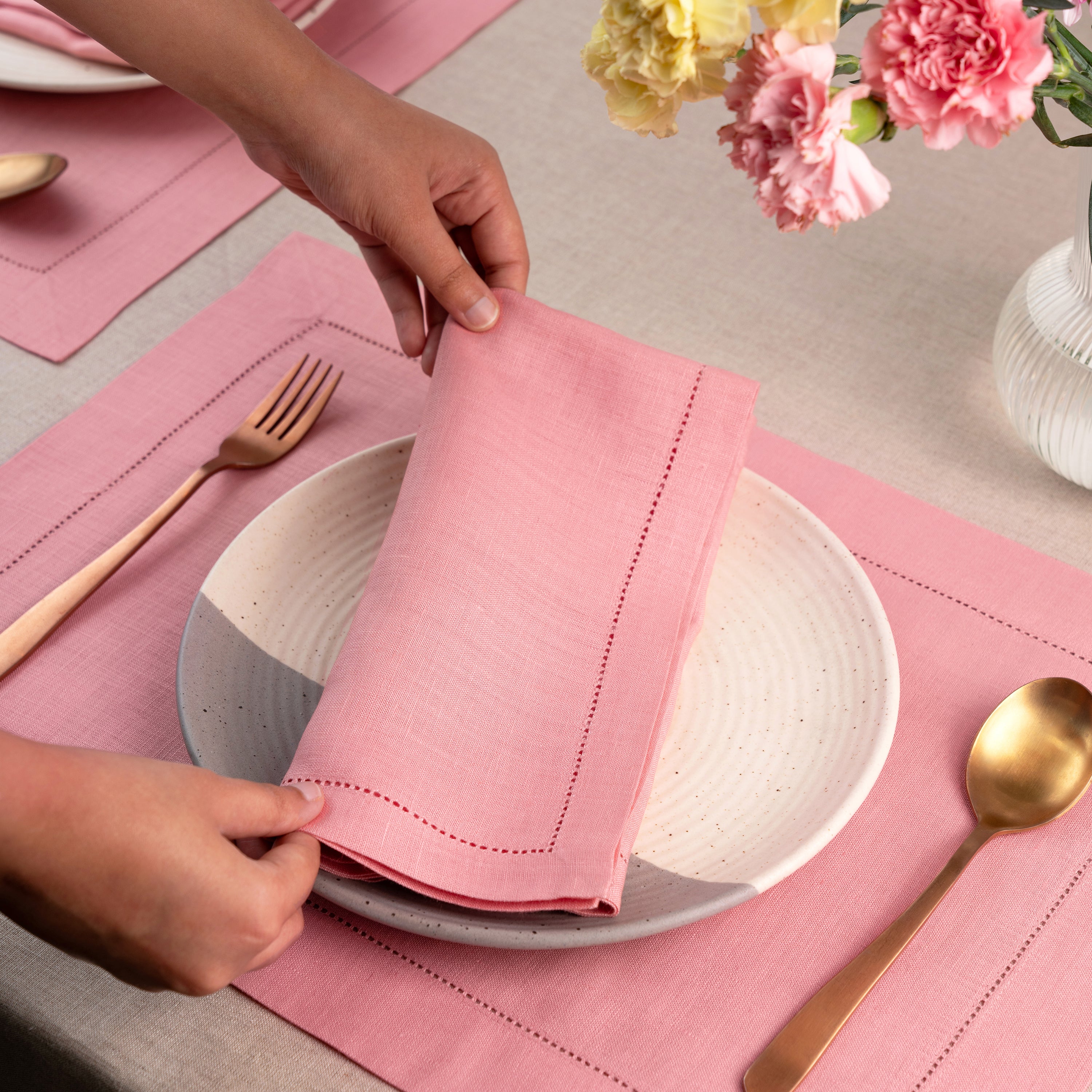 Dusty pink pure linen dinner napkins styled on a dining table