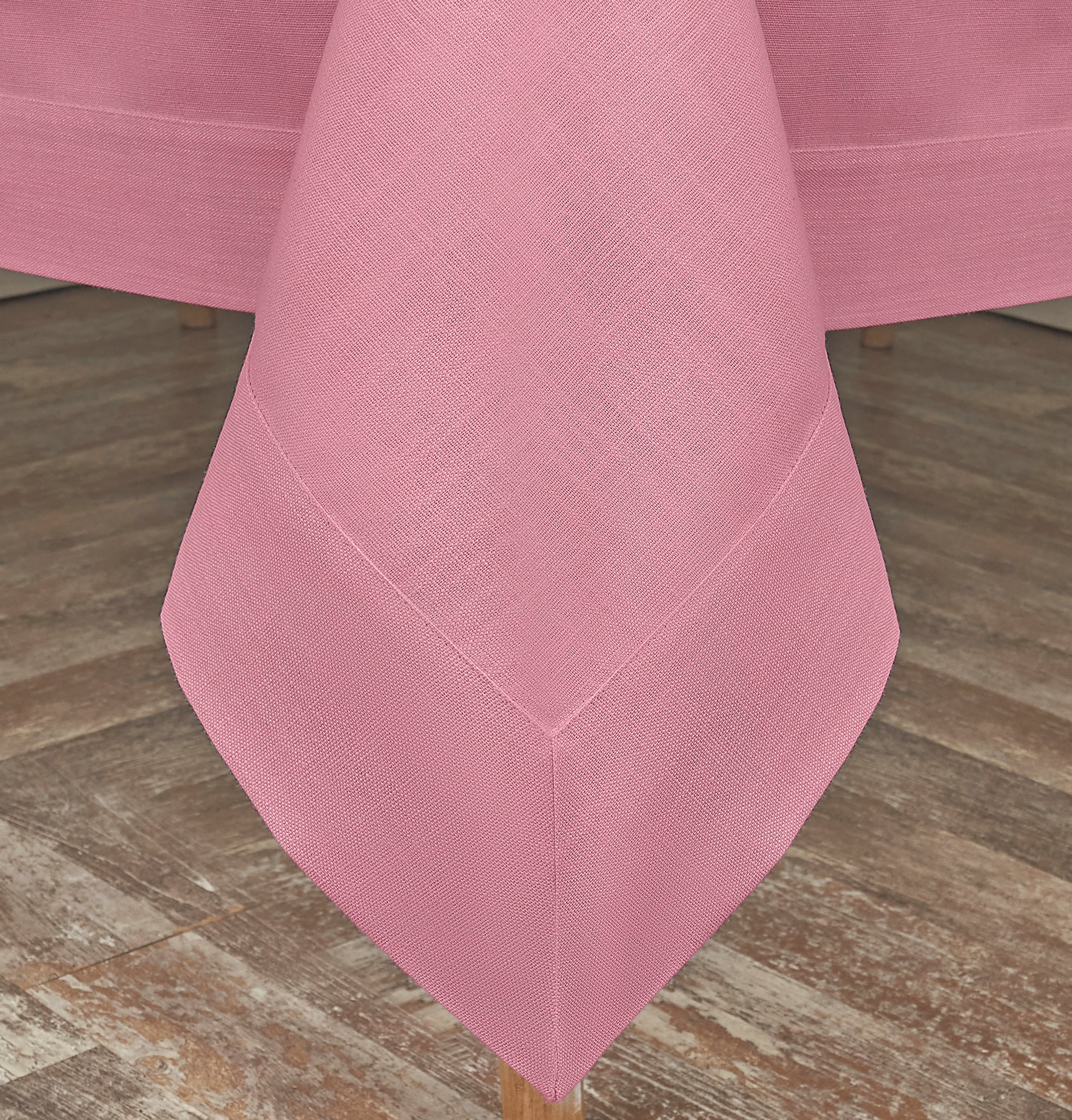 Dusty pink faux linen tablecloth styled on a dining table