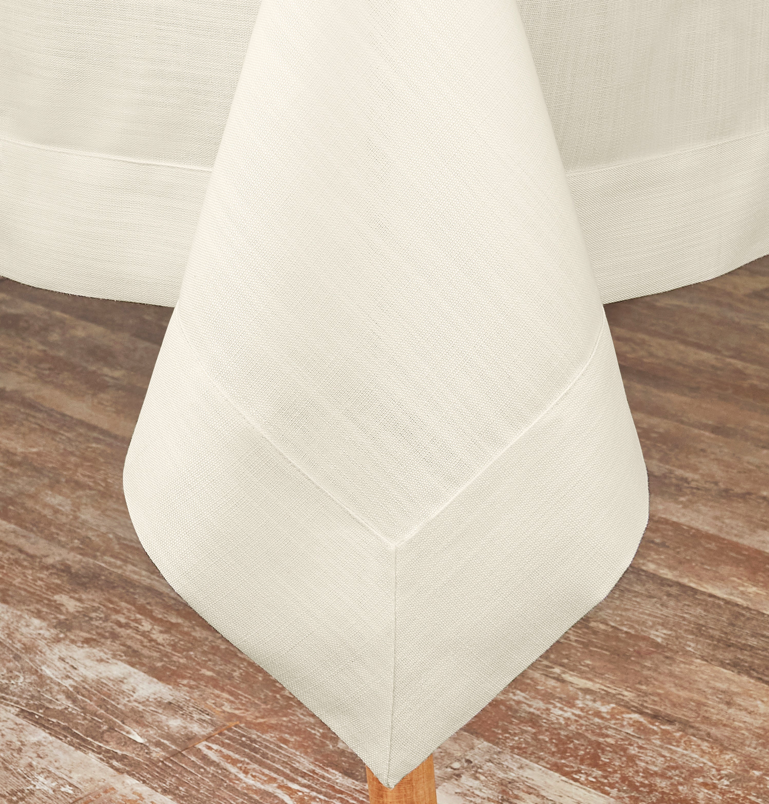Ivory faux linen tablecloth styled on a dining table