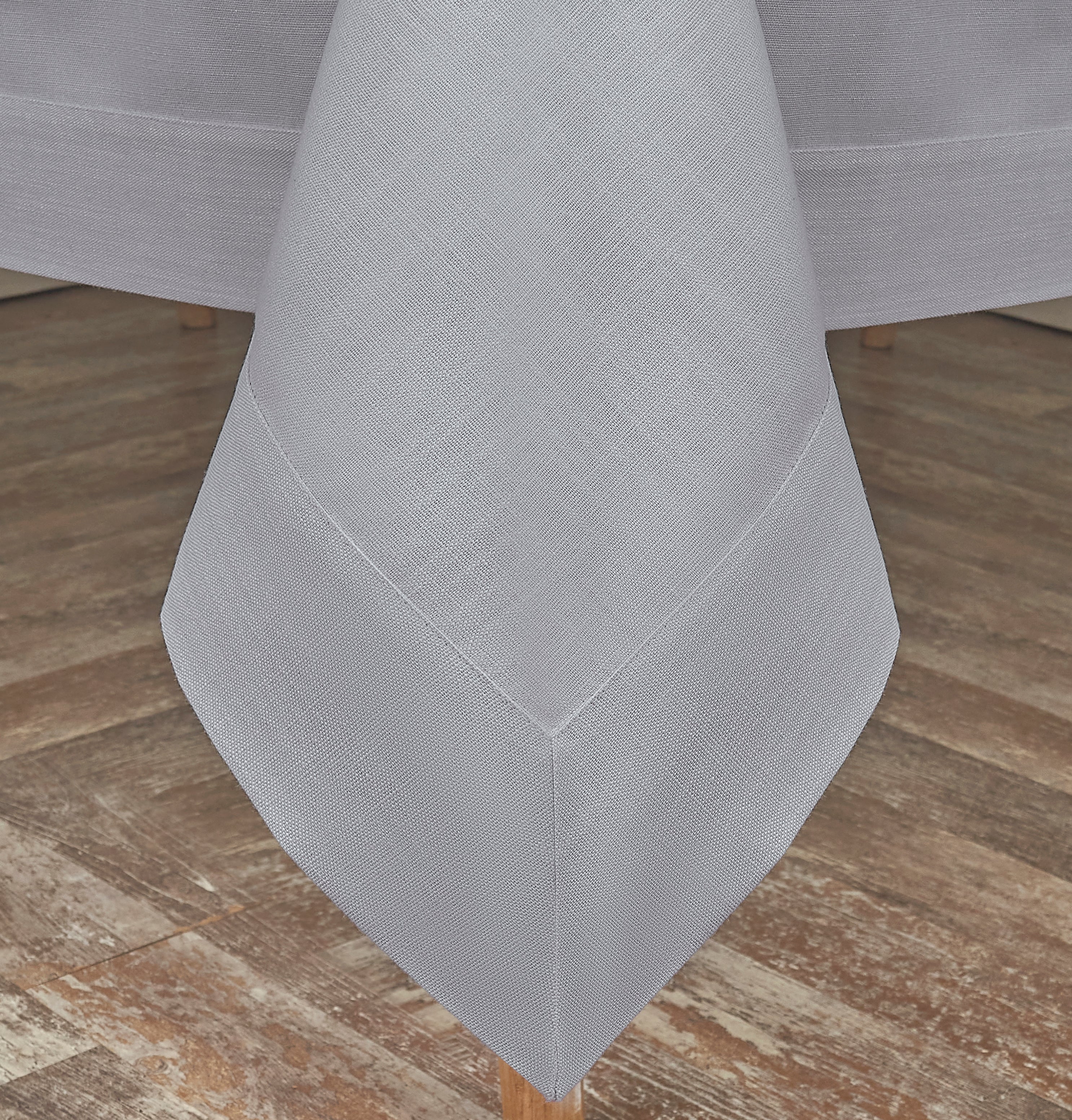 Light grey faux linen tablecloth styled on a dining table