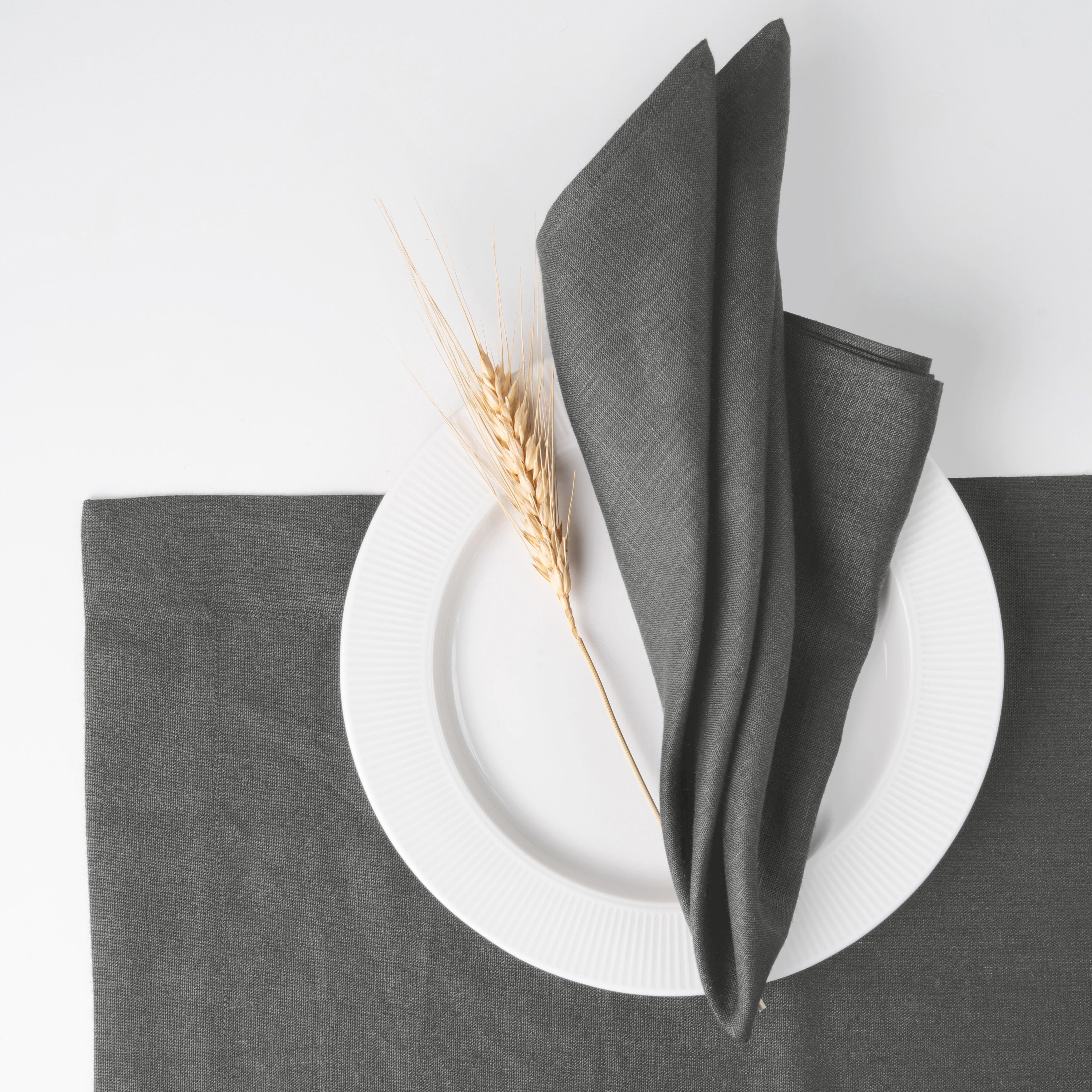 Charcoal grey pure linen dinner napkins styled on a dining table