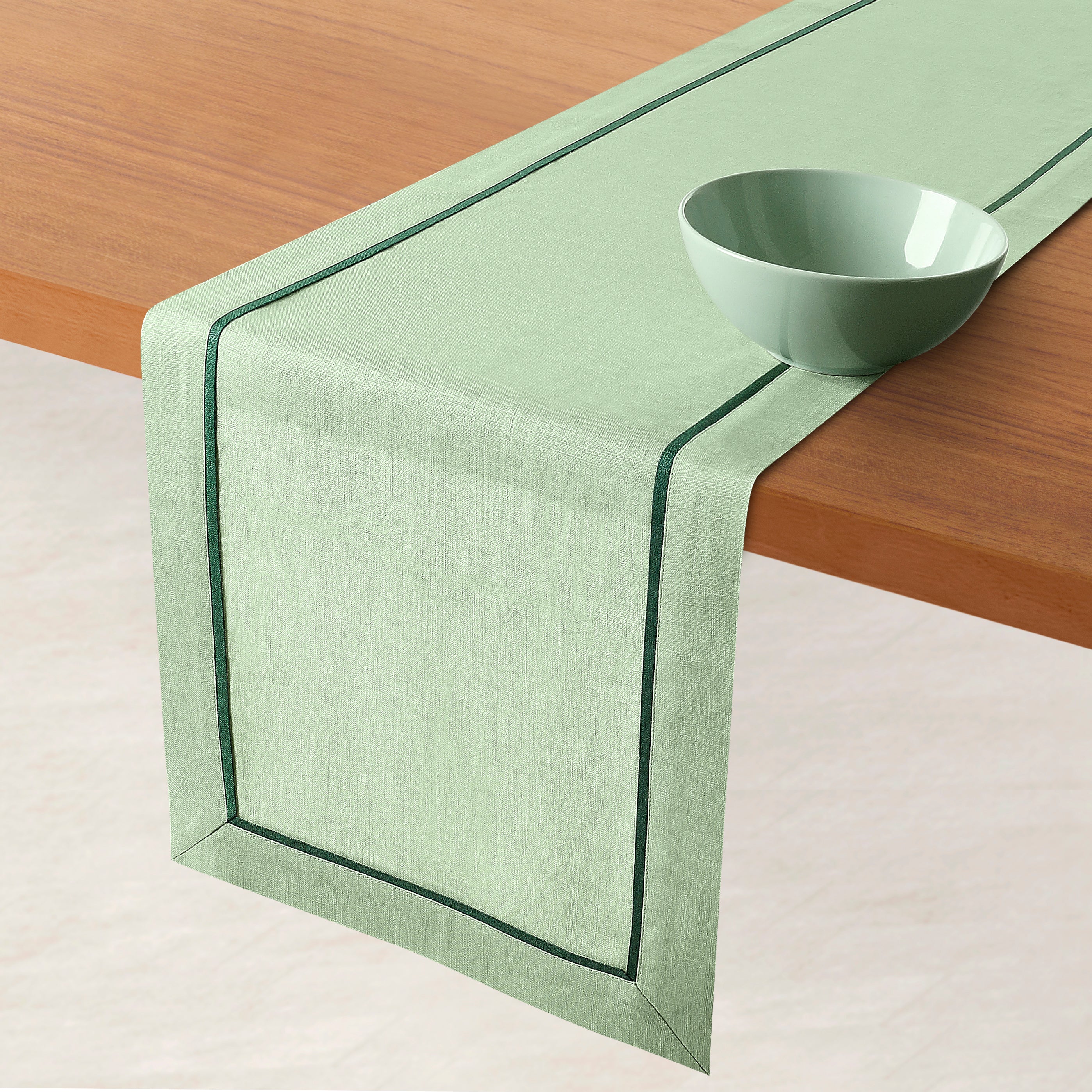 Sage green and forest pure linen table runner styled on a dining table