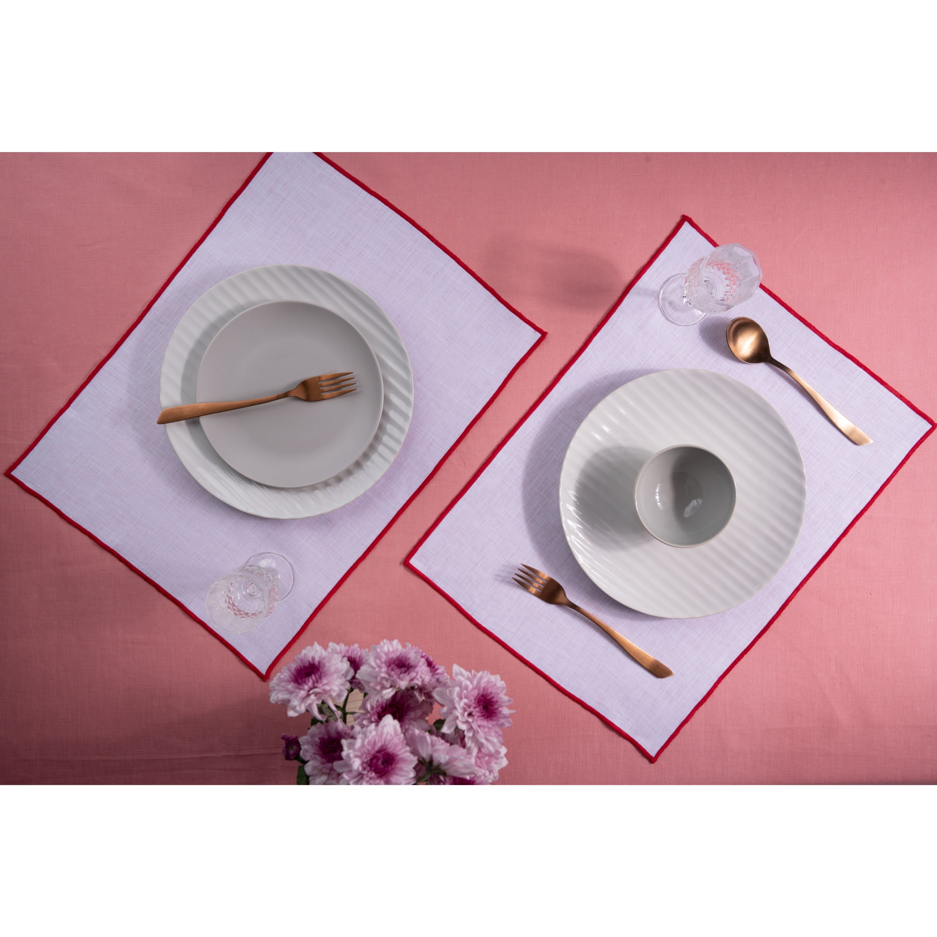 White and red pure linen placemats styled on a dining table