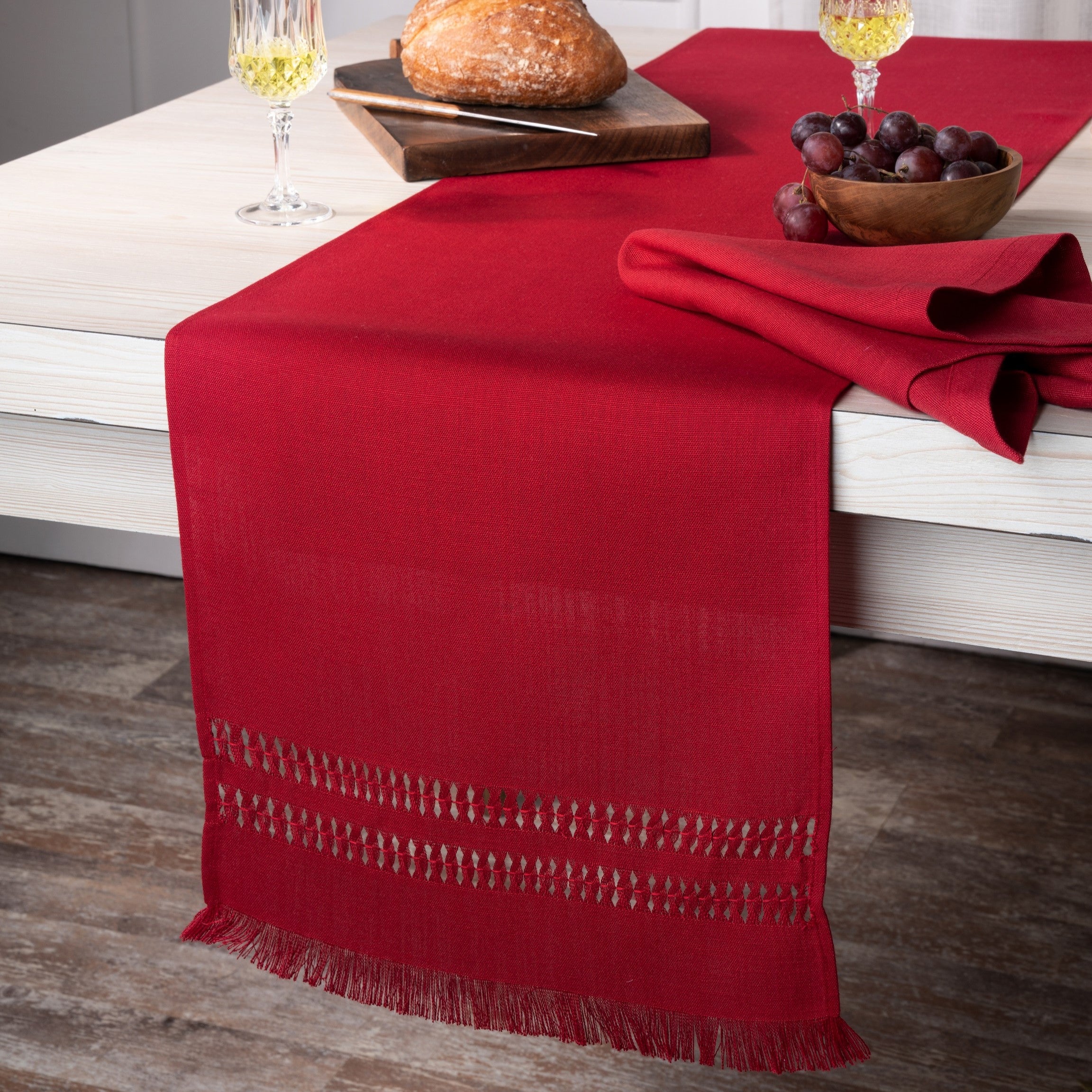Close-up of the hand-hemstitch edge on a red faux linen table runner