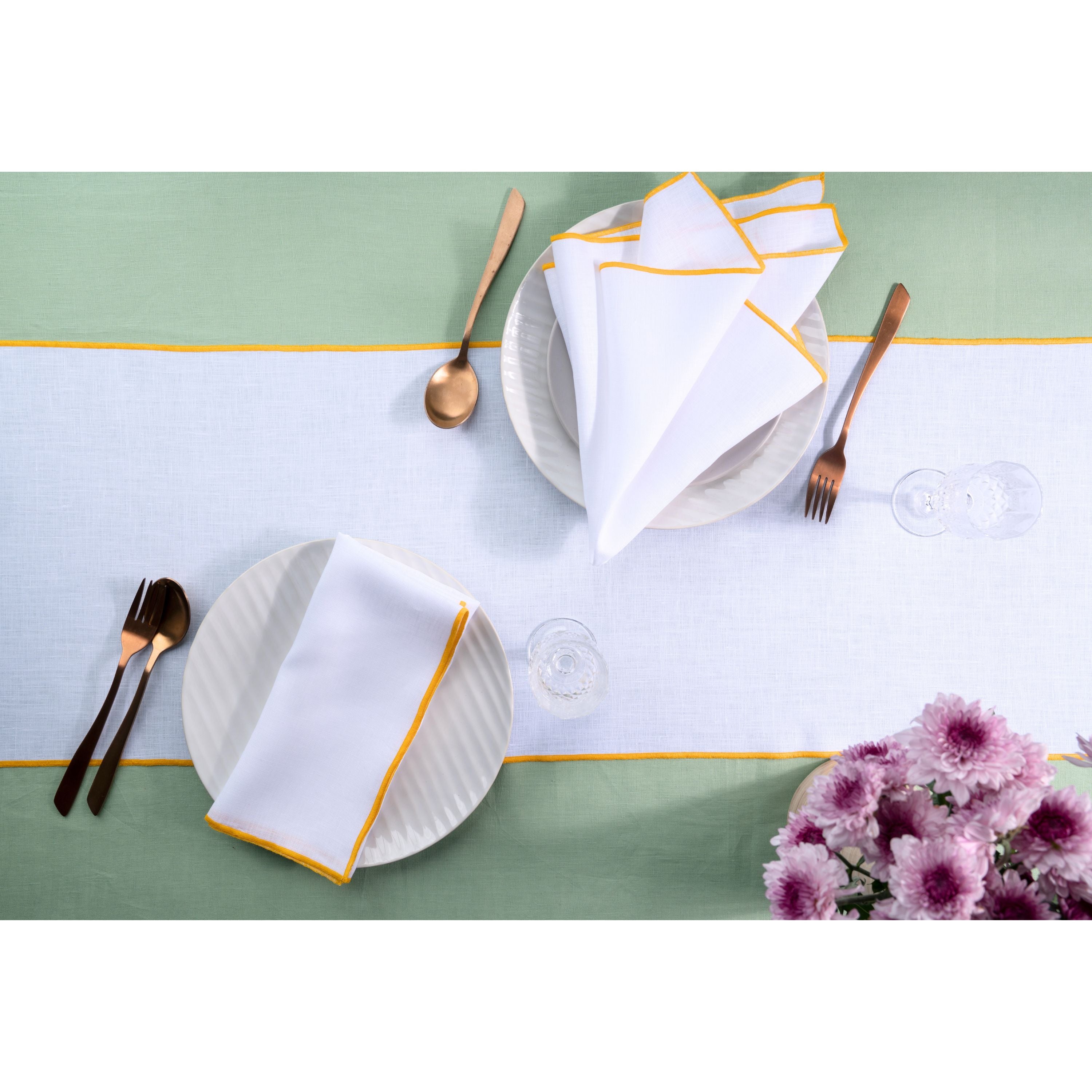 White and yellow pure linen table runner styled on a dining table