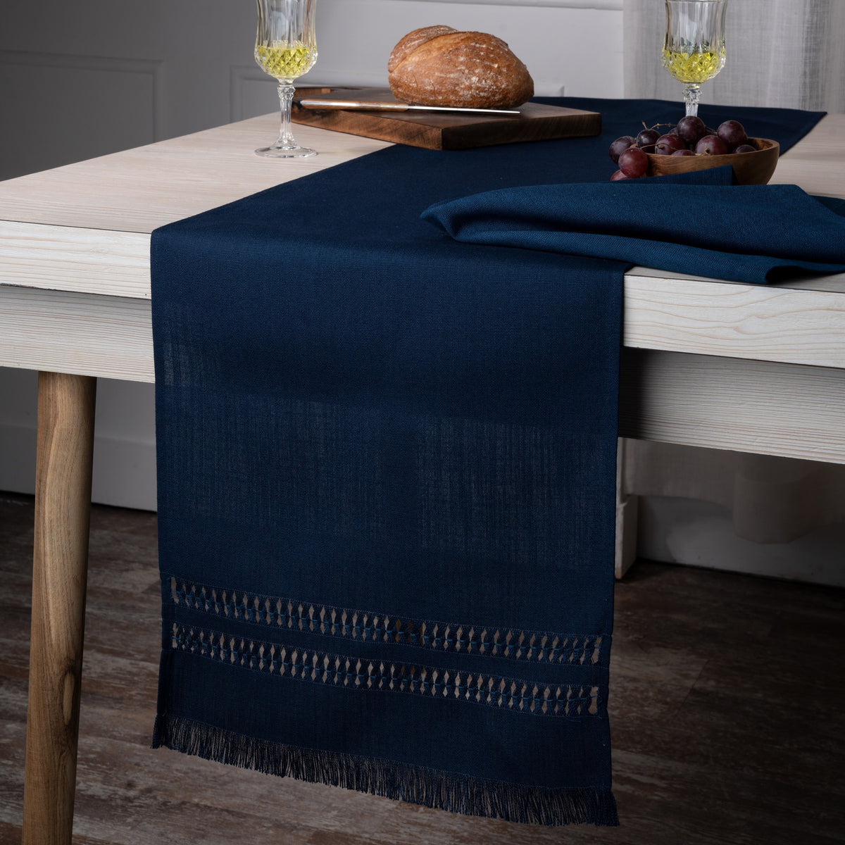 Close-up of the hand-hemstitch edge on a navy blue faux linen table runner