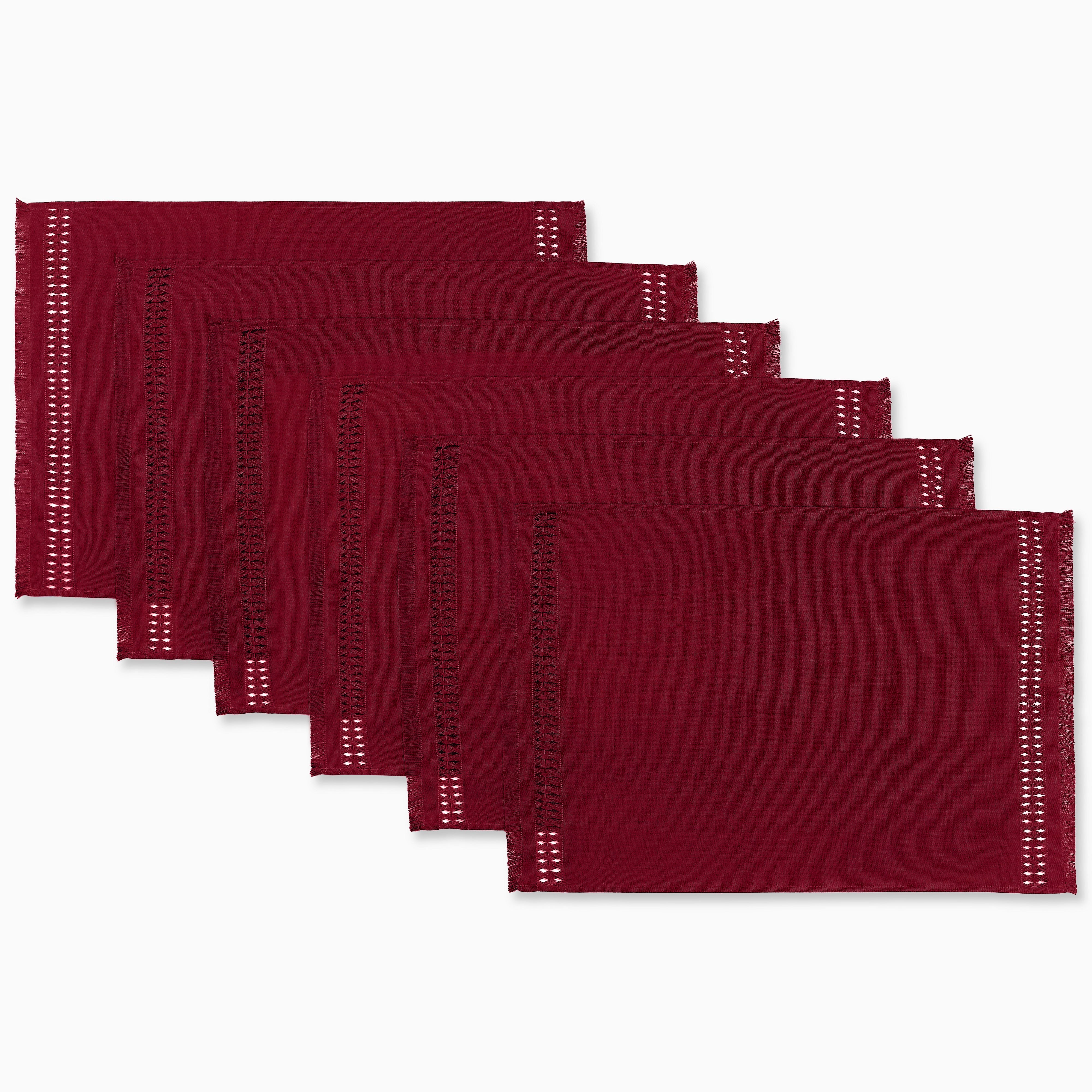 Red faux linen placemats styled on a dining table