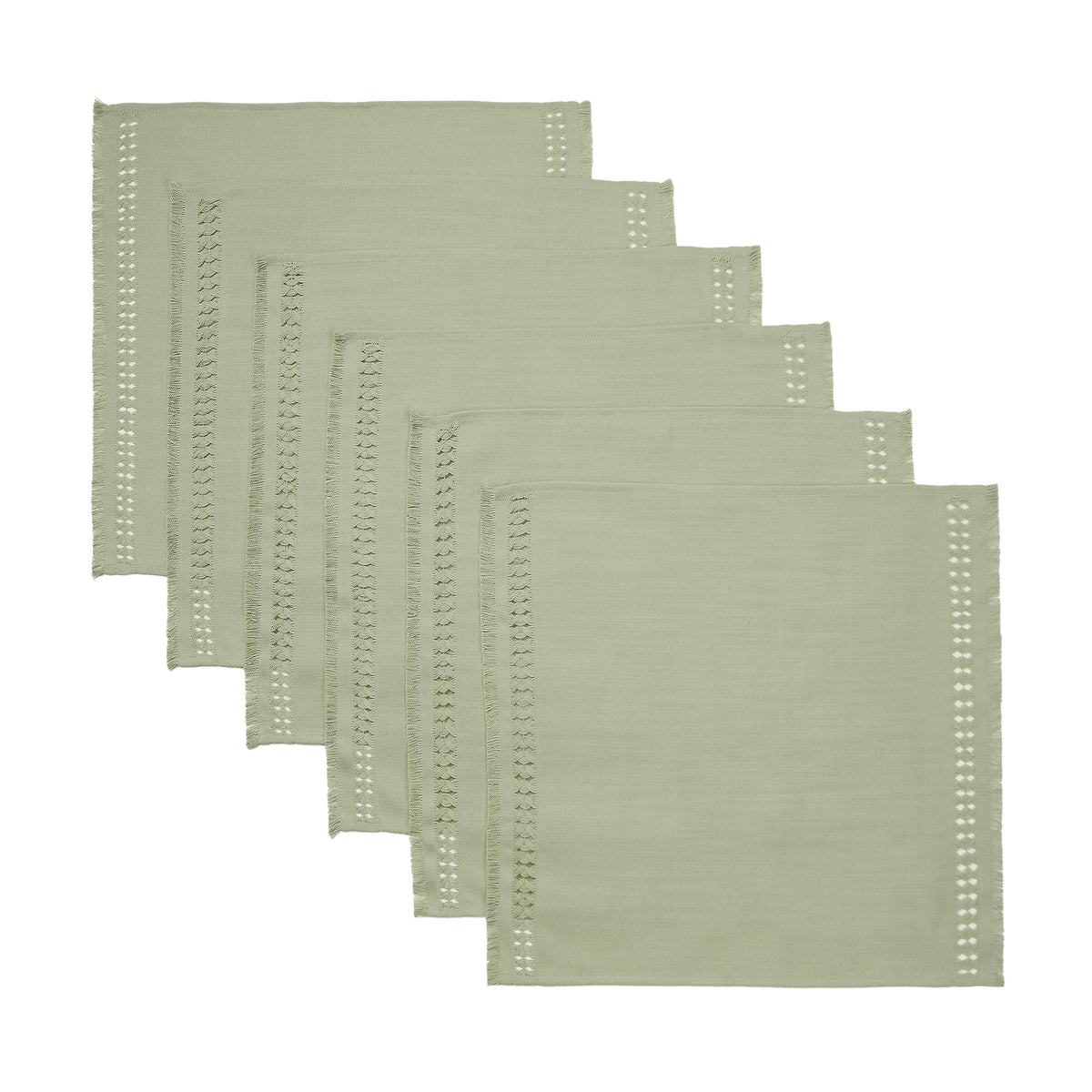 Sage green faux linen dinner napkins styled on a dining table