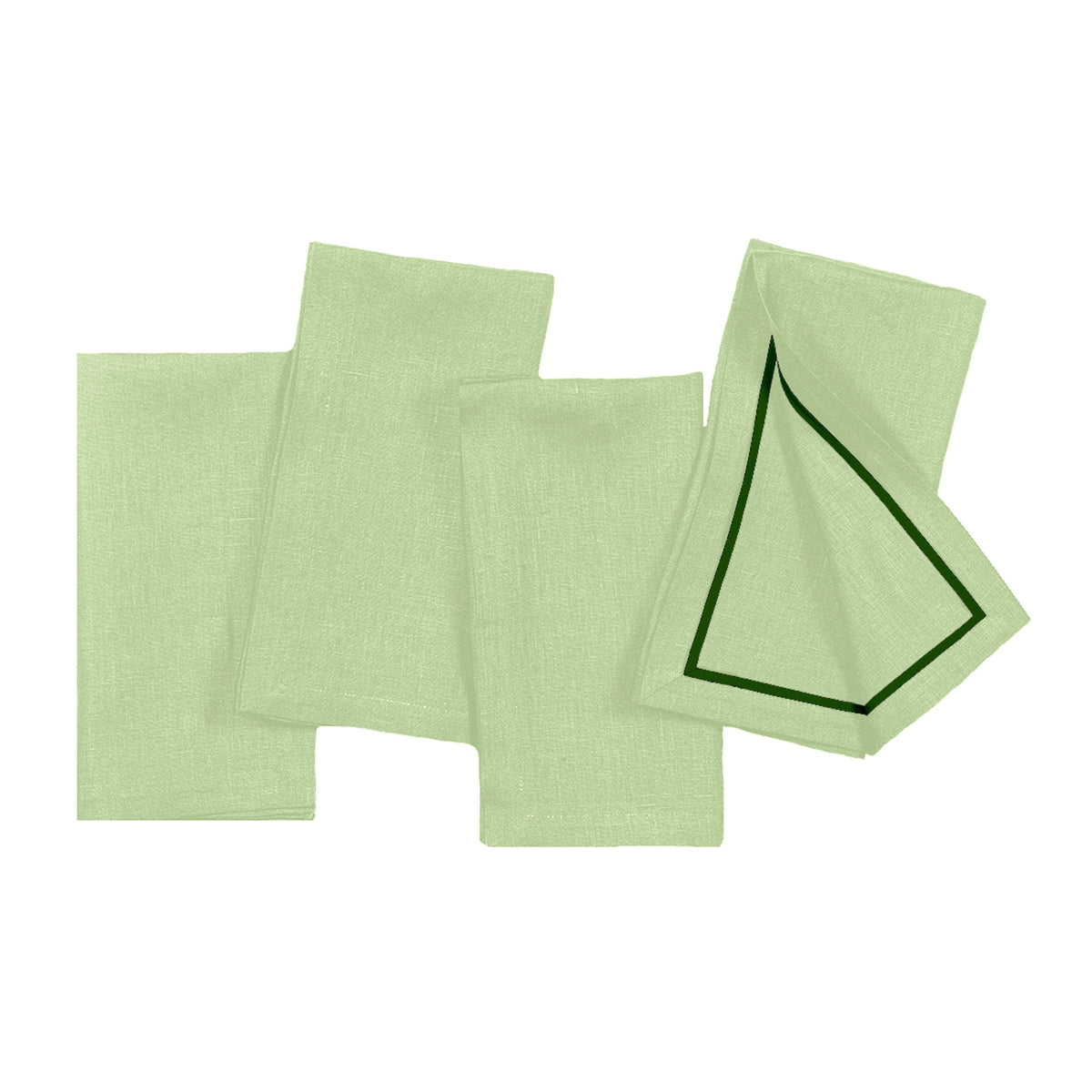 Sage green and forest pure linen dinner napkins styled on a dining table