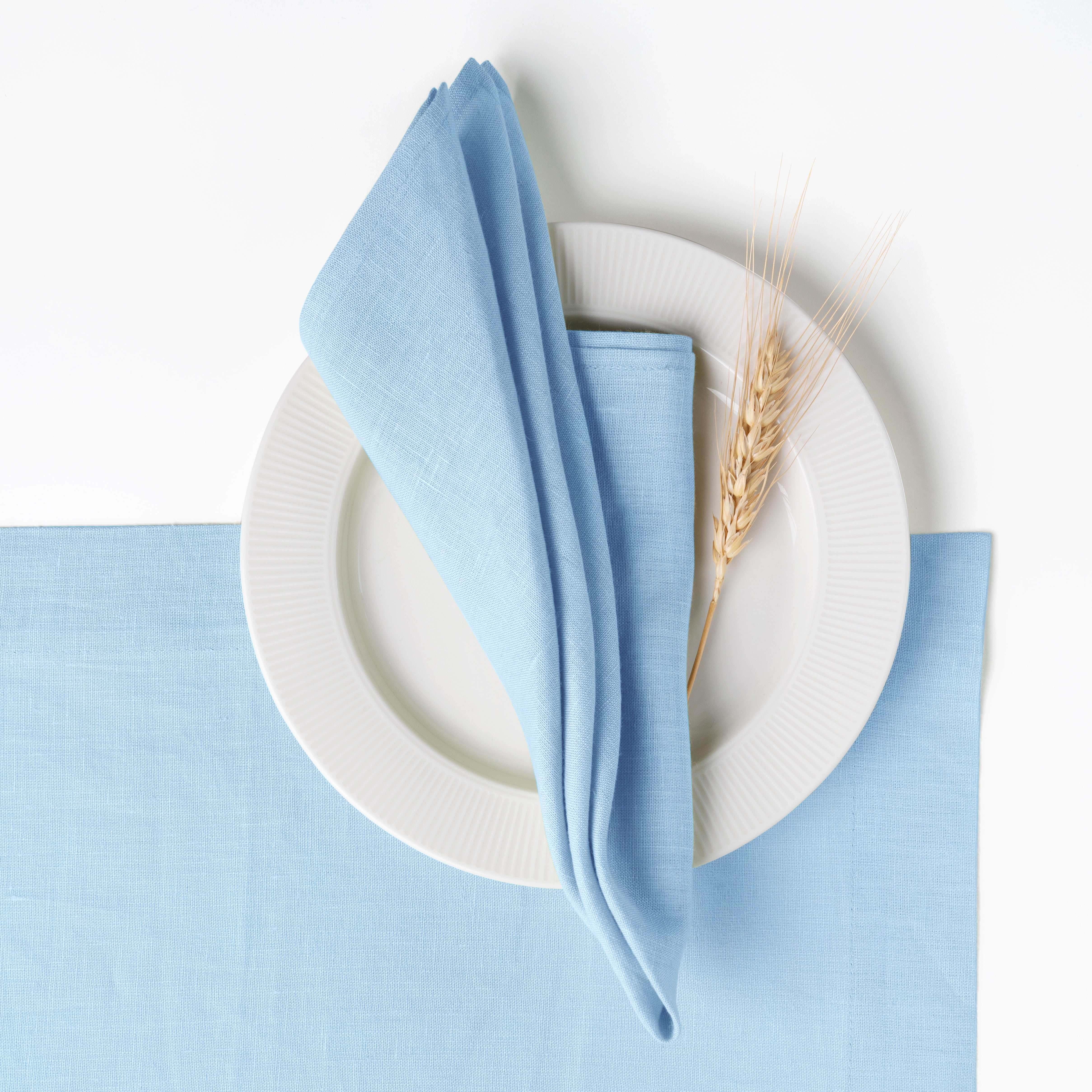 Powder blue pure linen dinner napkins styled on a dining table