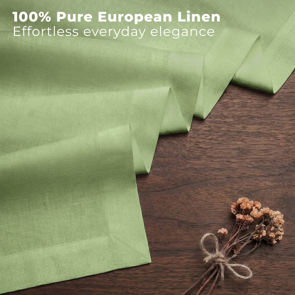 Sage green pure linen table runner styled on a dining table