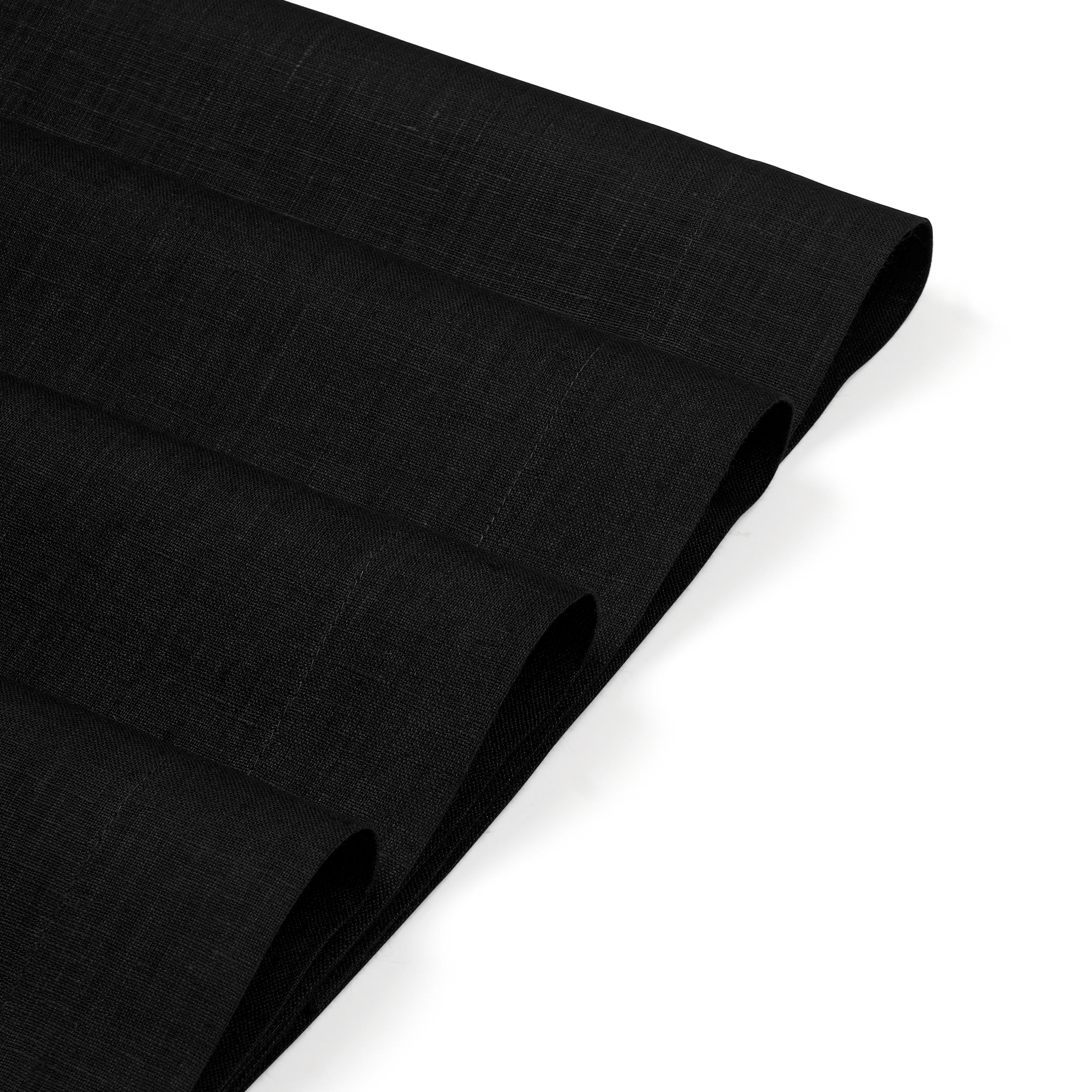 Black linen placemats with matching D'Moksha table linens