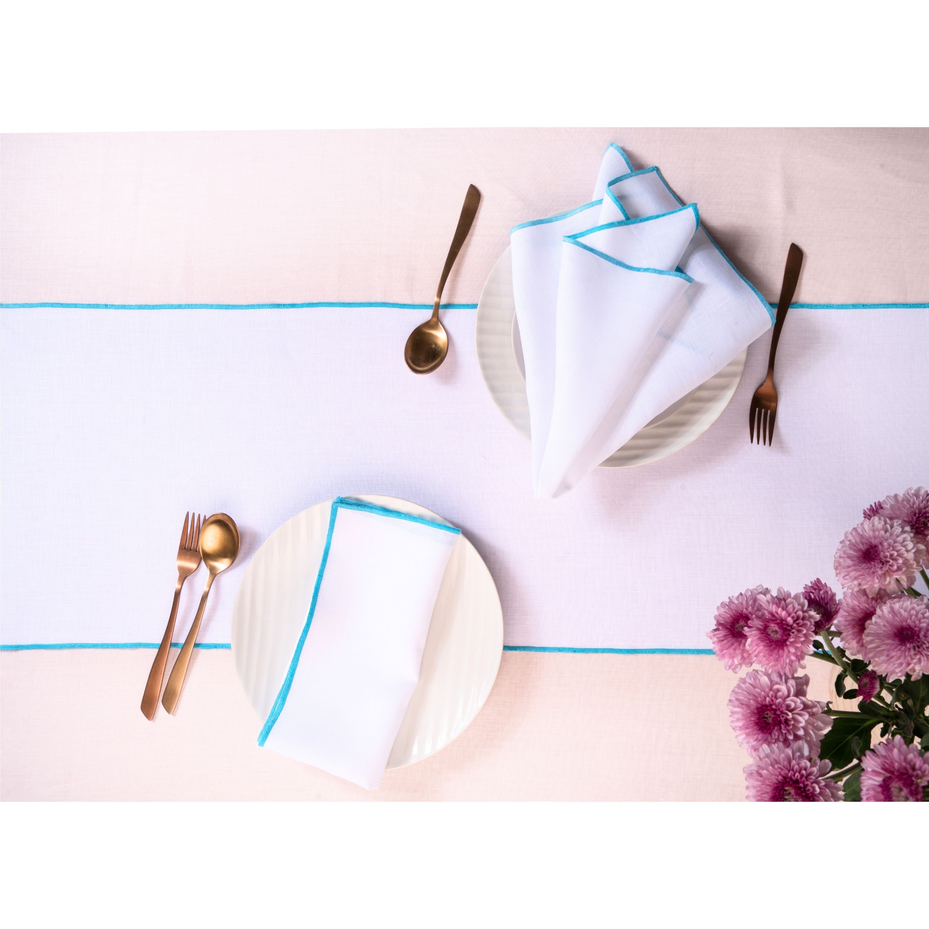 White and blue pure linen table runner styled on a dining table