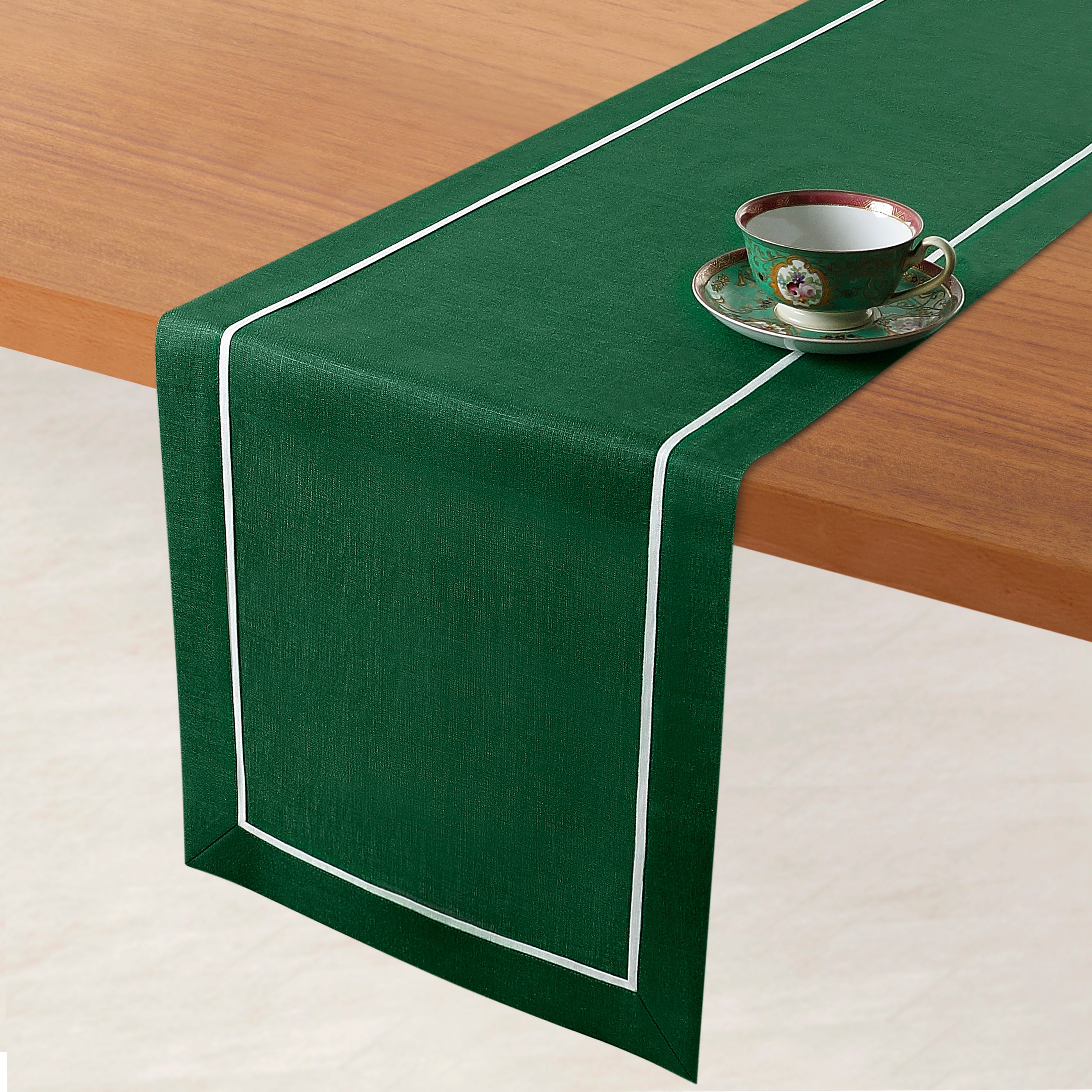 Forest green and white pure linen table runner styled on a dining table