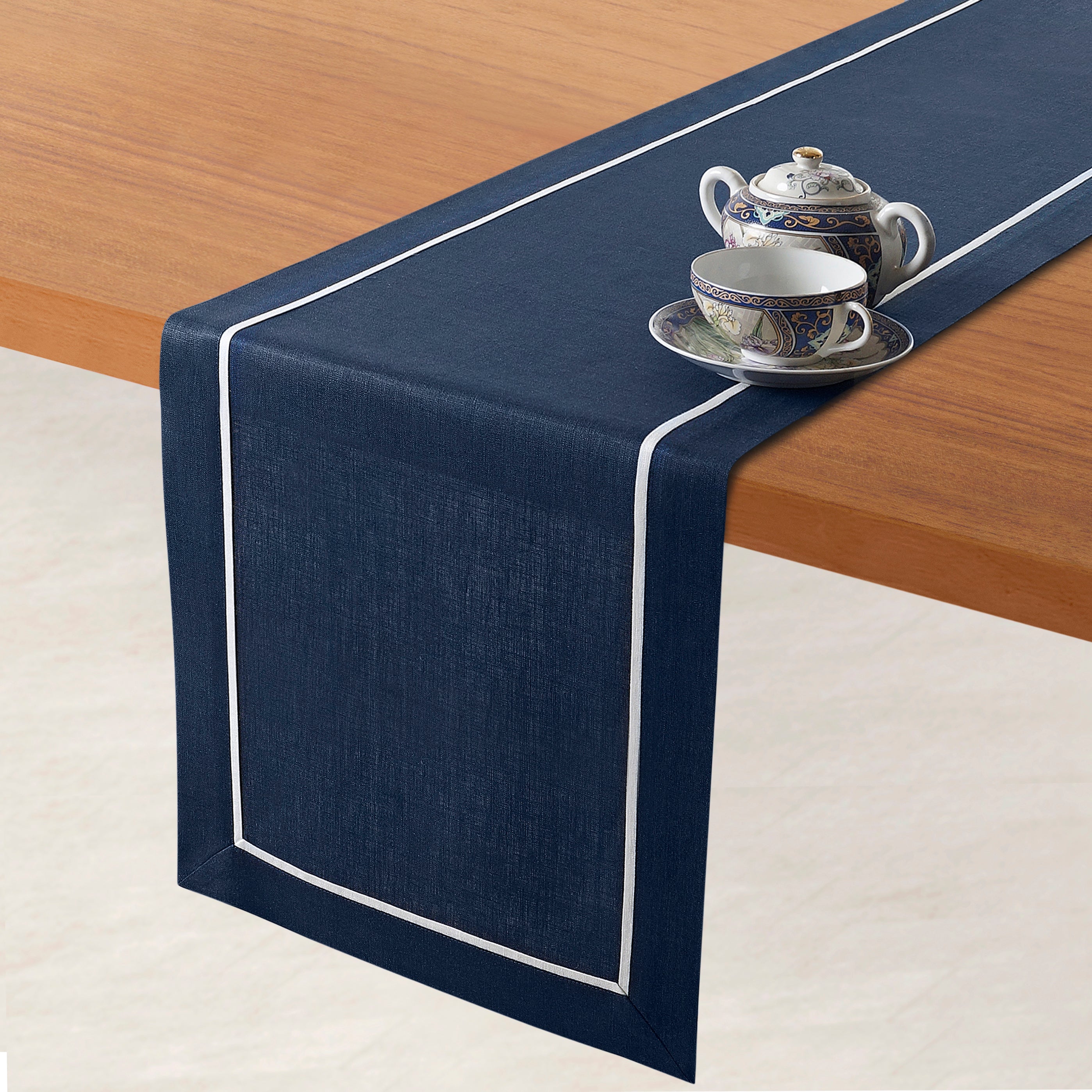 Navy blue and white pure linen table runner styled on a dining table