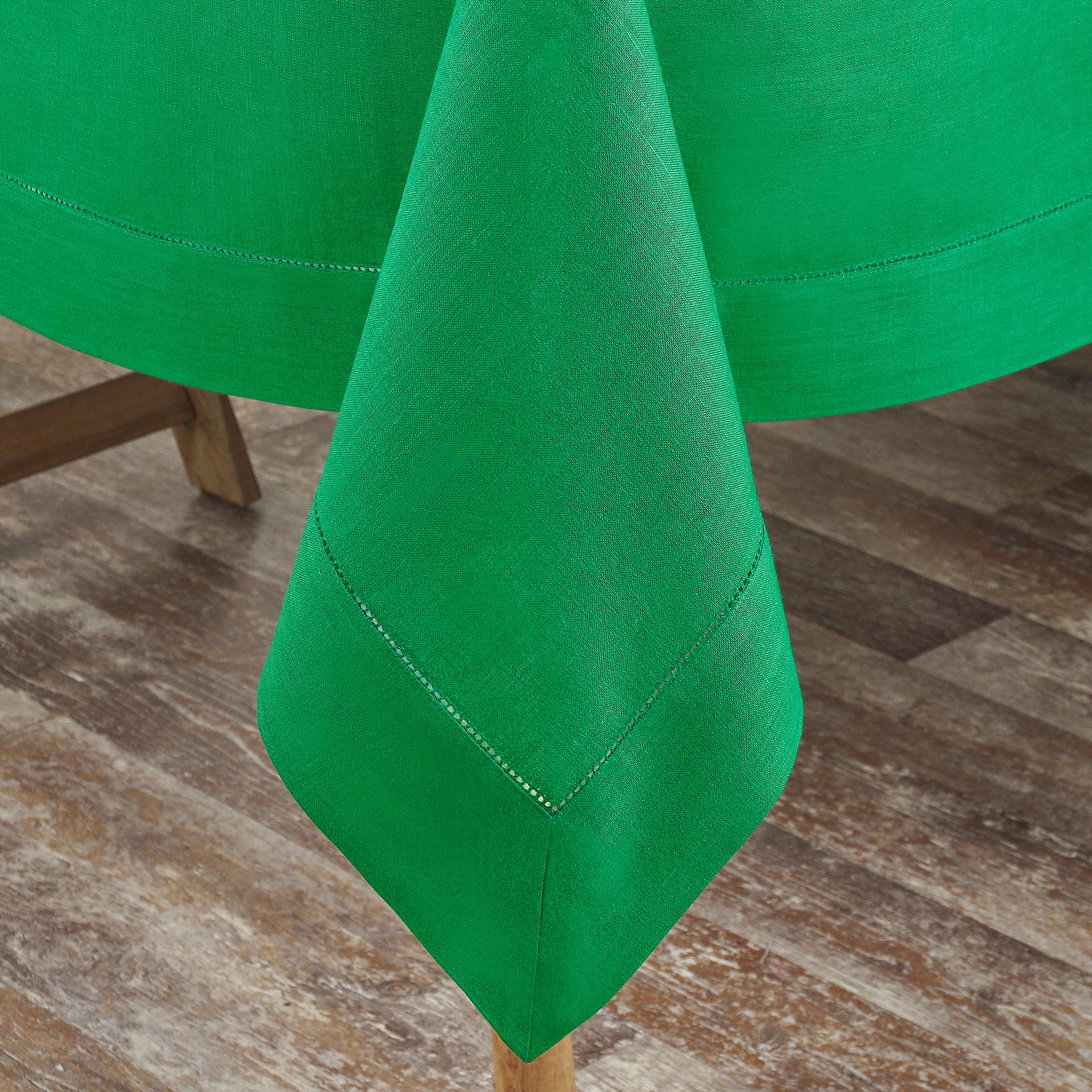 Kelly green pure linen tablecloth styled on a dining table