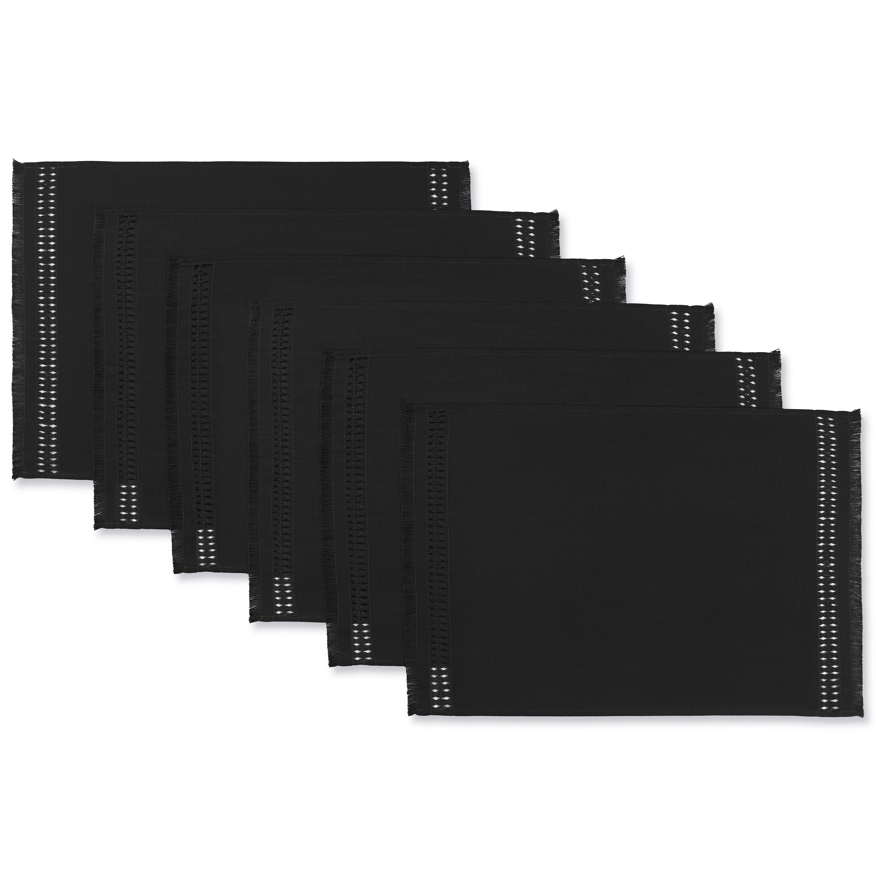 Black faux linen placemats styled on a dining table
