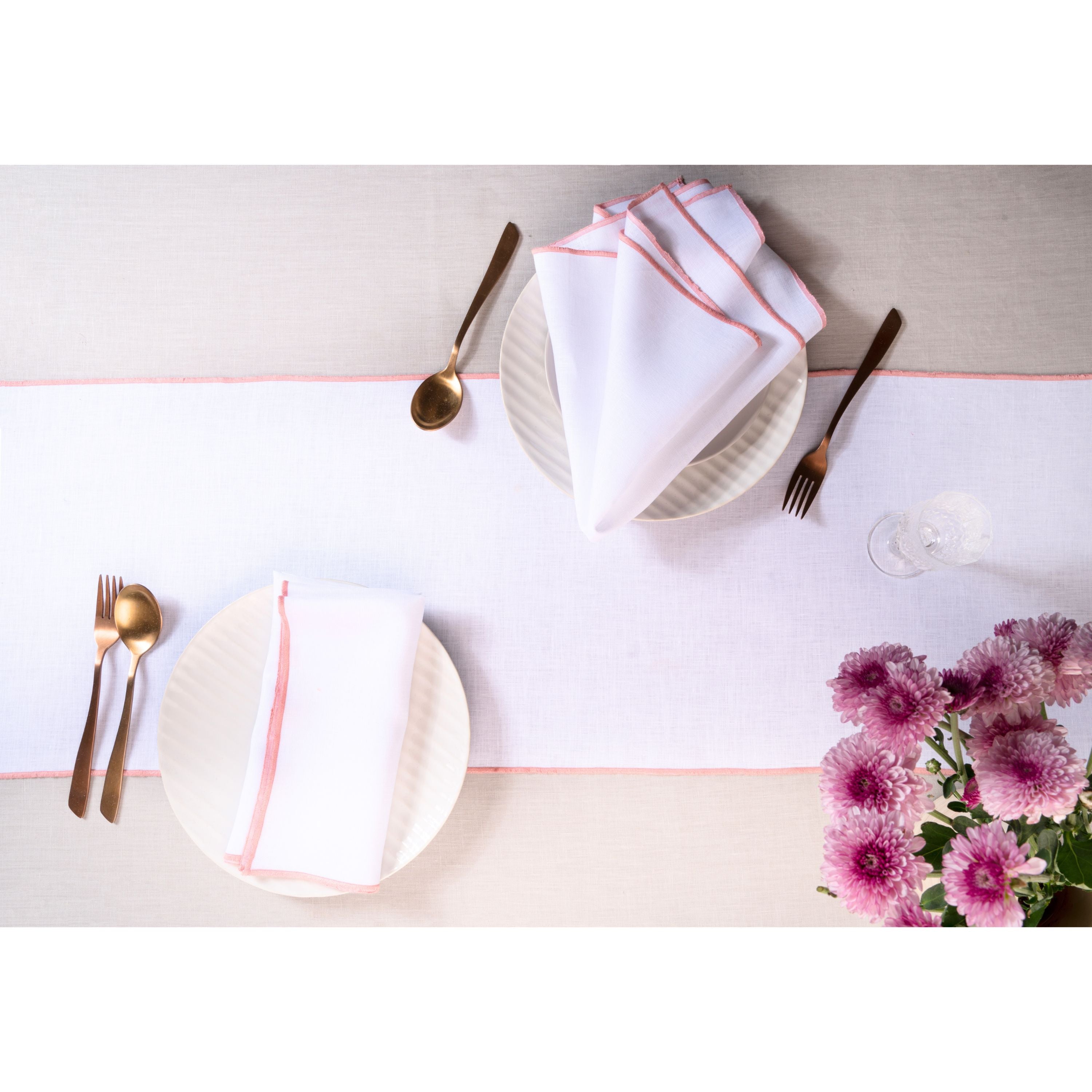 White and dusty pink pure linen table runner styled on a dining table