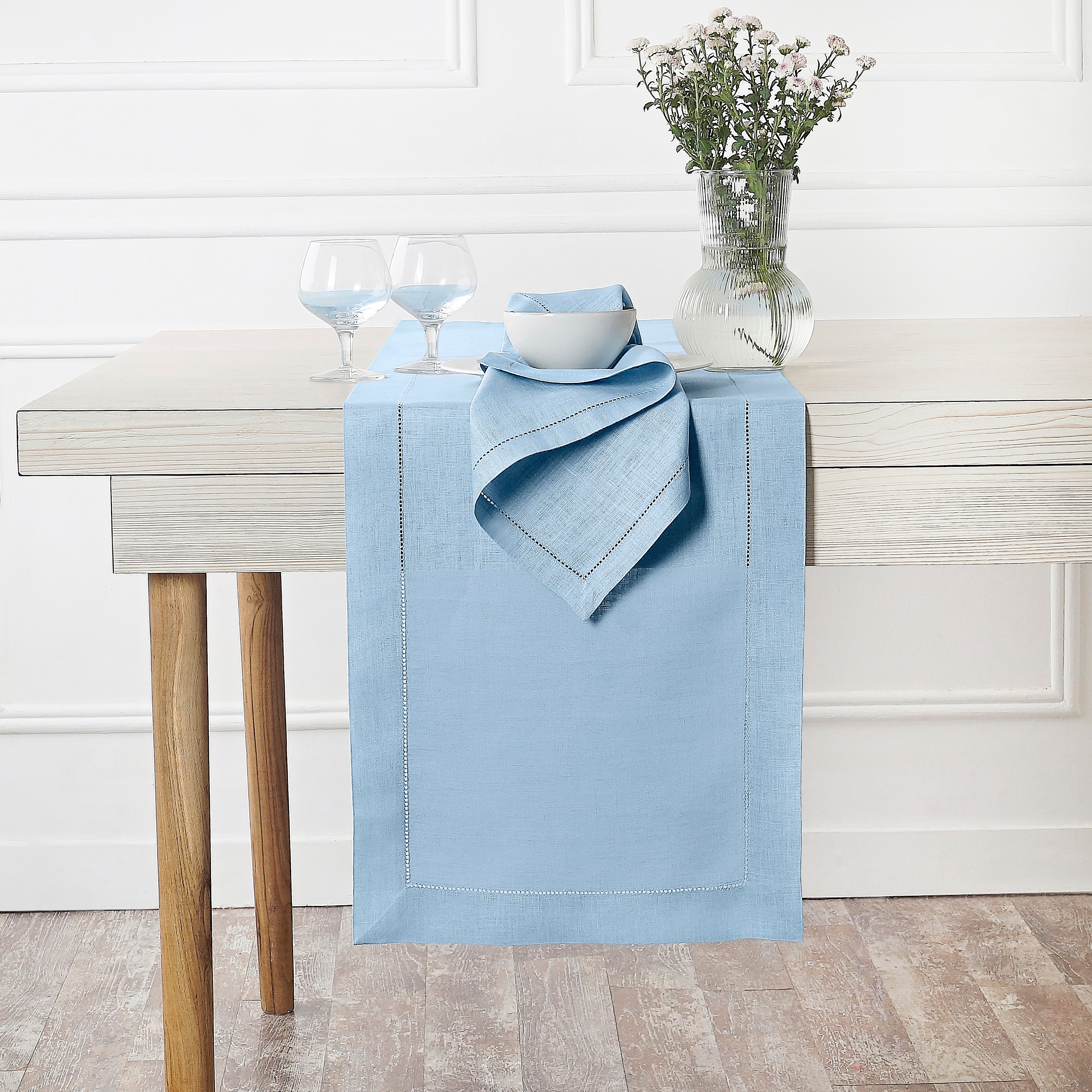 Powder blue pure linen table runner styled on a dining table