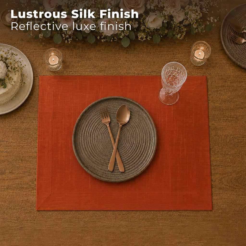 Rust Luxe Shine placemats styled on a dining table
