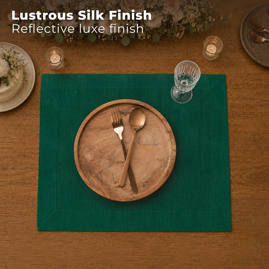 Emerald green Luxe Shine placemats styled on a dining table