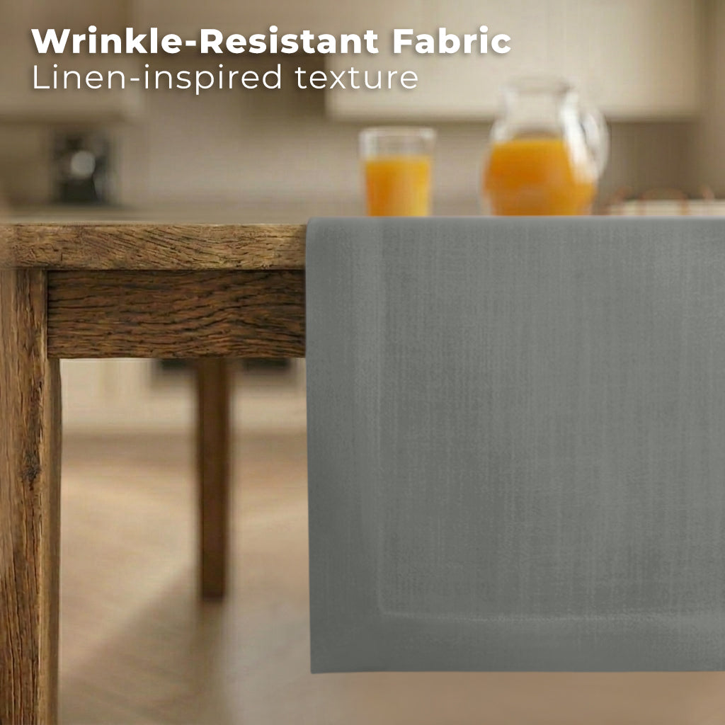 Charcoal grey faux linen table runner styled on a dining table