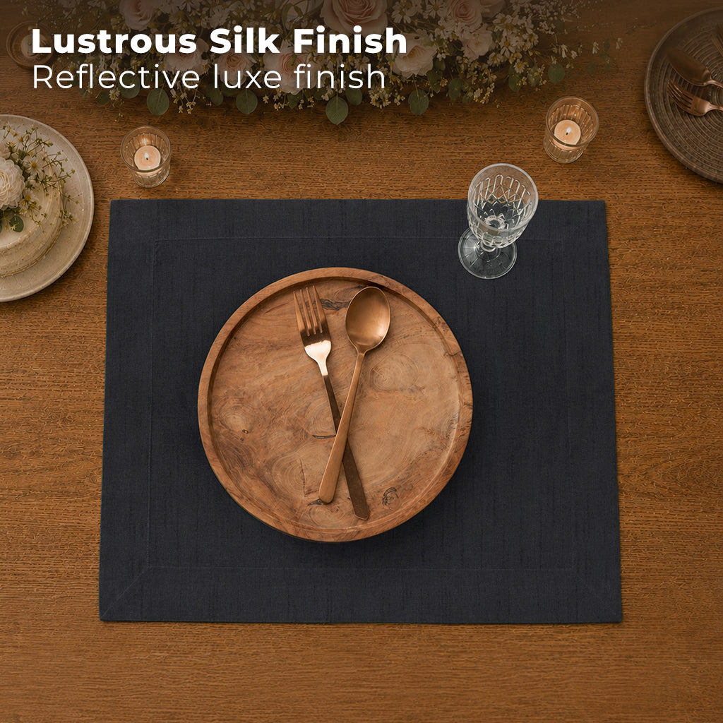 Black Luxe Shine placemats styled on a dining table