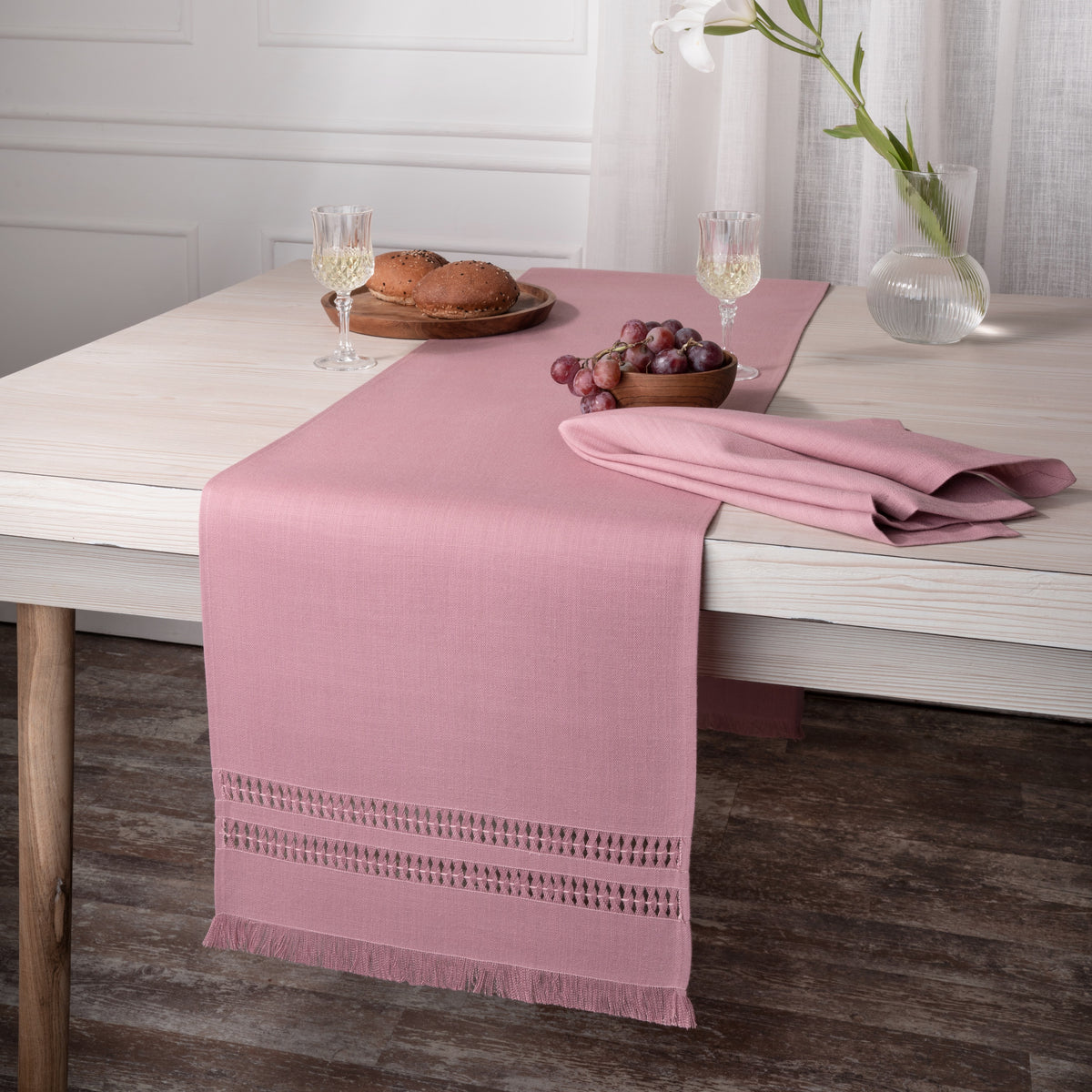 Close-up of the hand-hemstitch edge on a dusty pink faux linen table runner