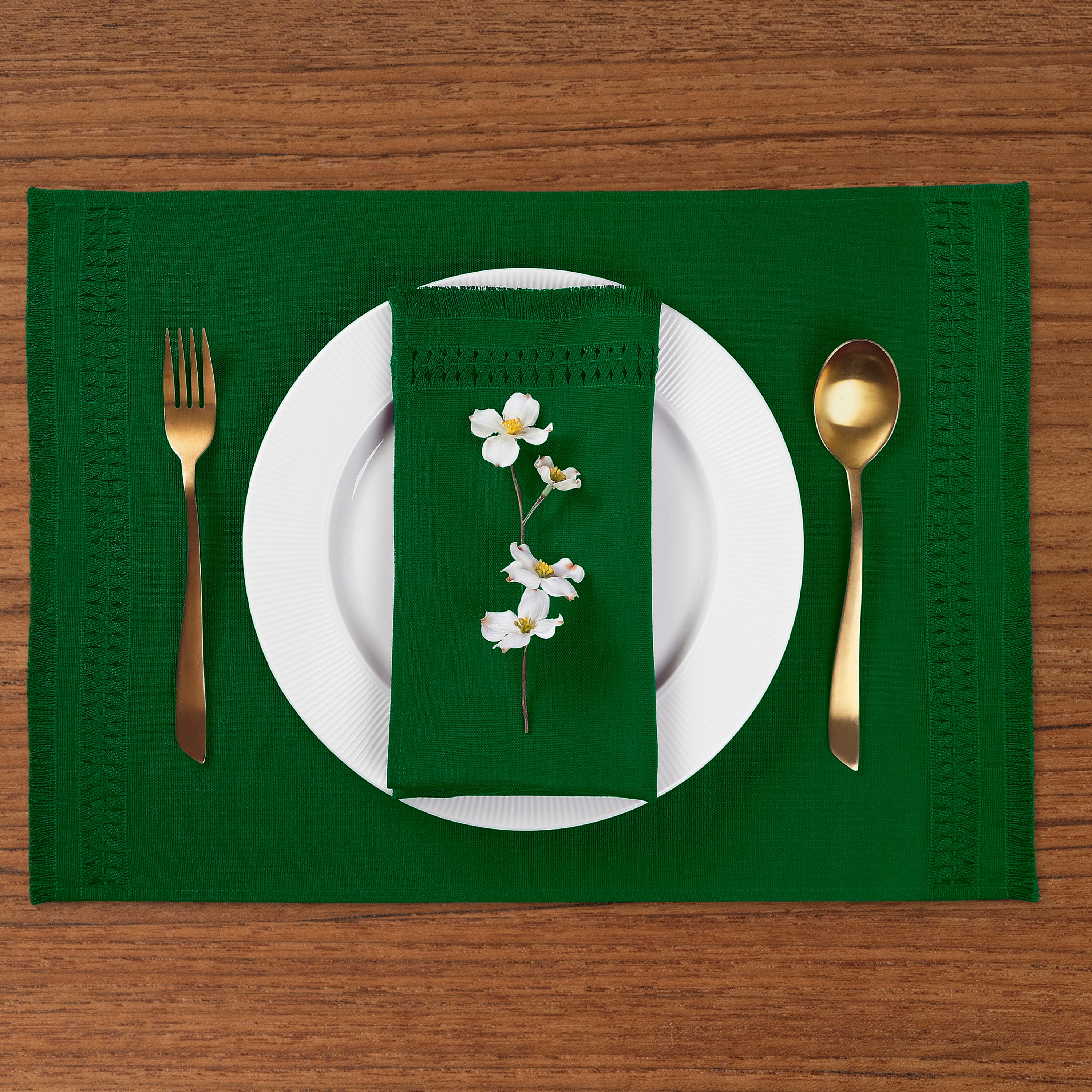 Close-up of the hand-hemstitch edge on eden green faux linen placemats