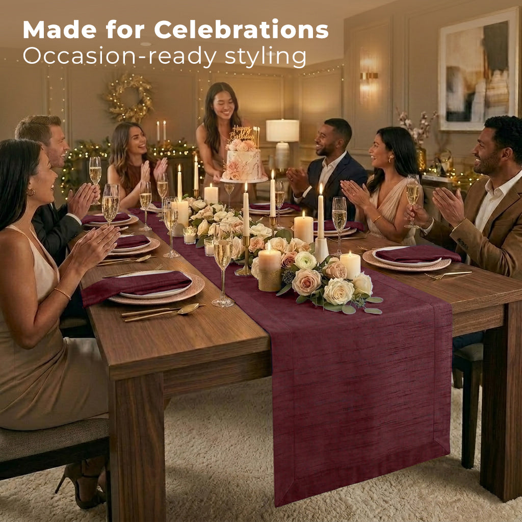 Close-up of the mitered corners on a wine red Luxe Shine table runner