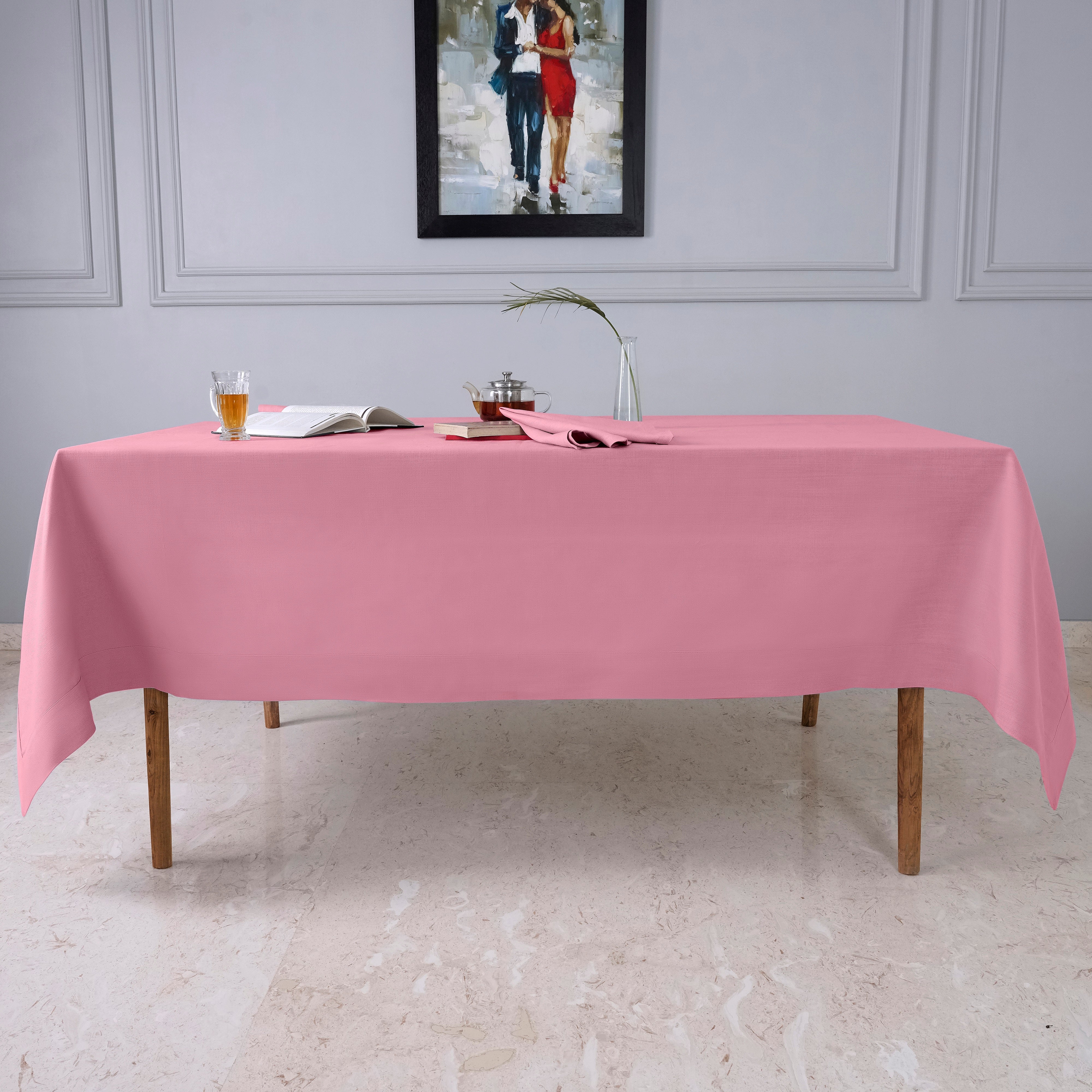 Close-up of the mitered corners on a dusty pink faux linen tablecloth