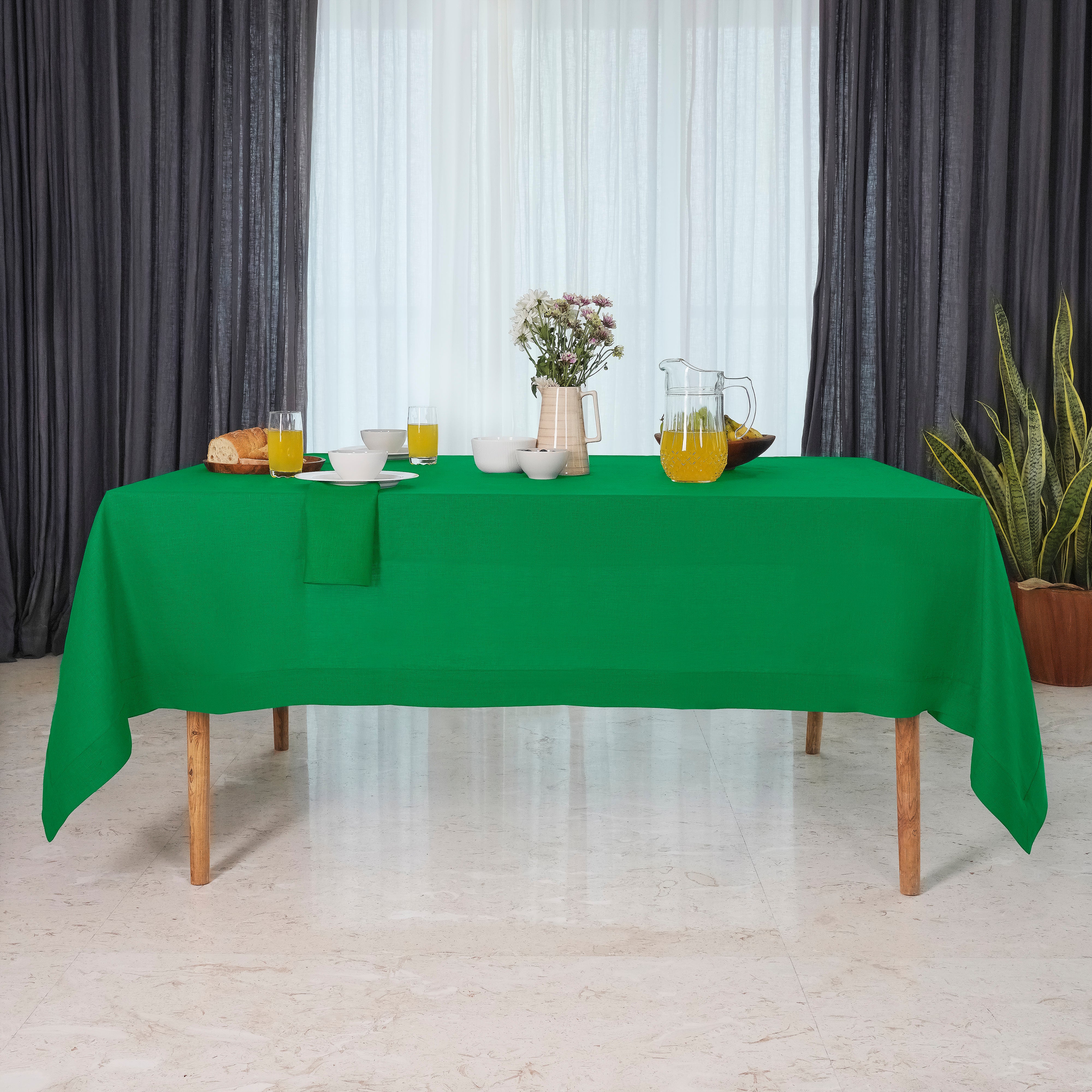 Close-up of the mitered corners on a kelly green pure linen tablecloth