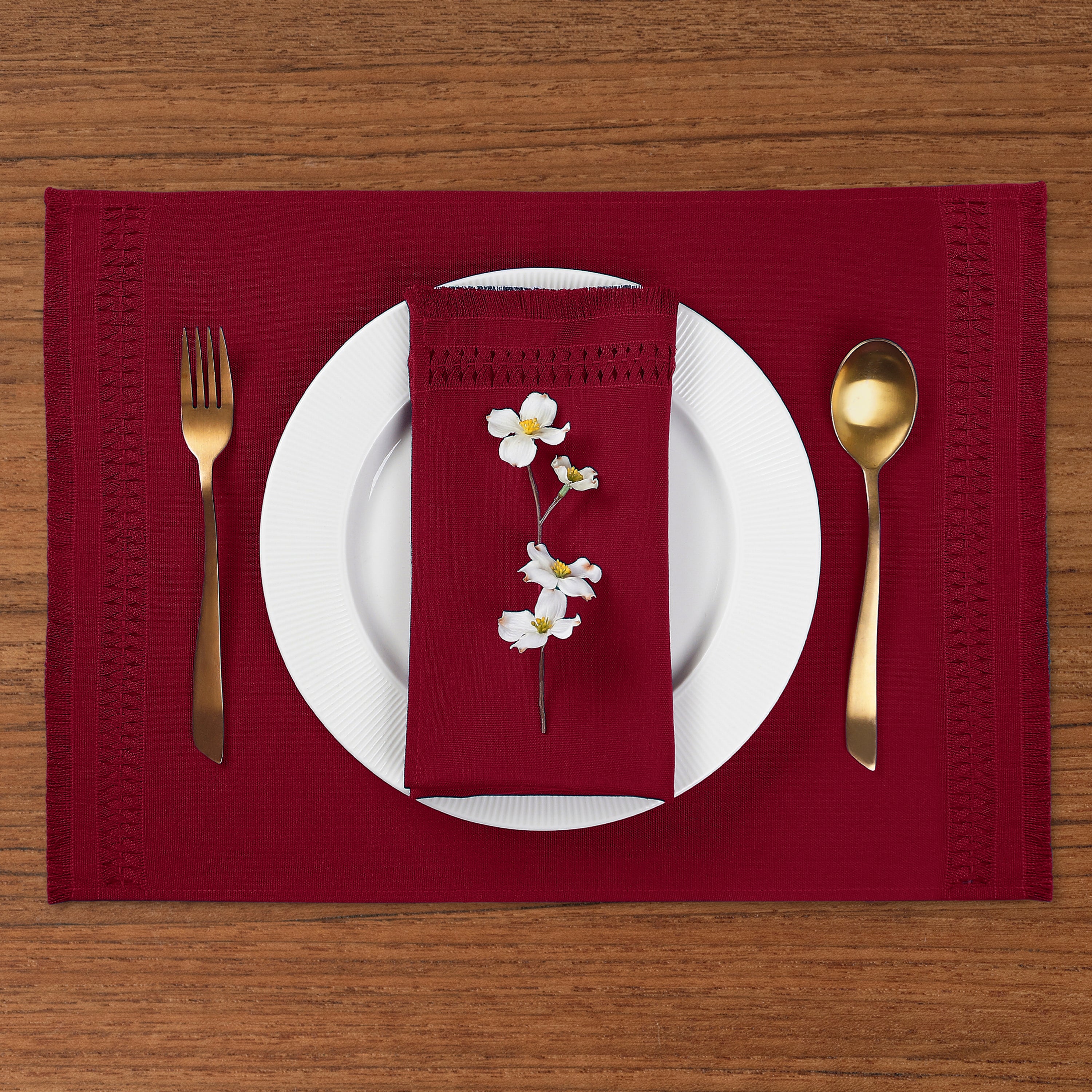 Close-up of the hand-hemstitch edge on red faux linen placemats