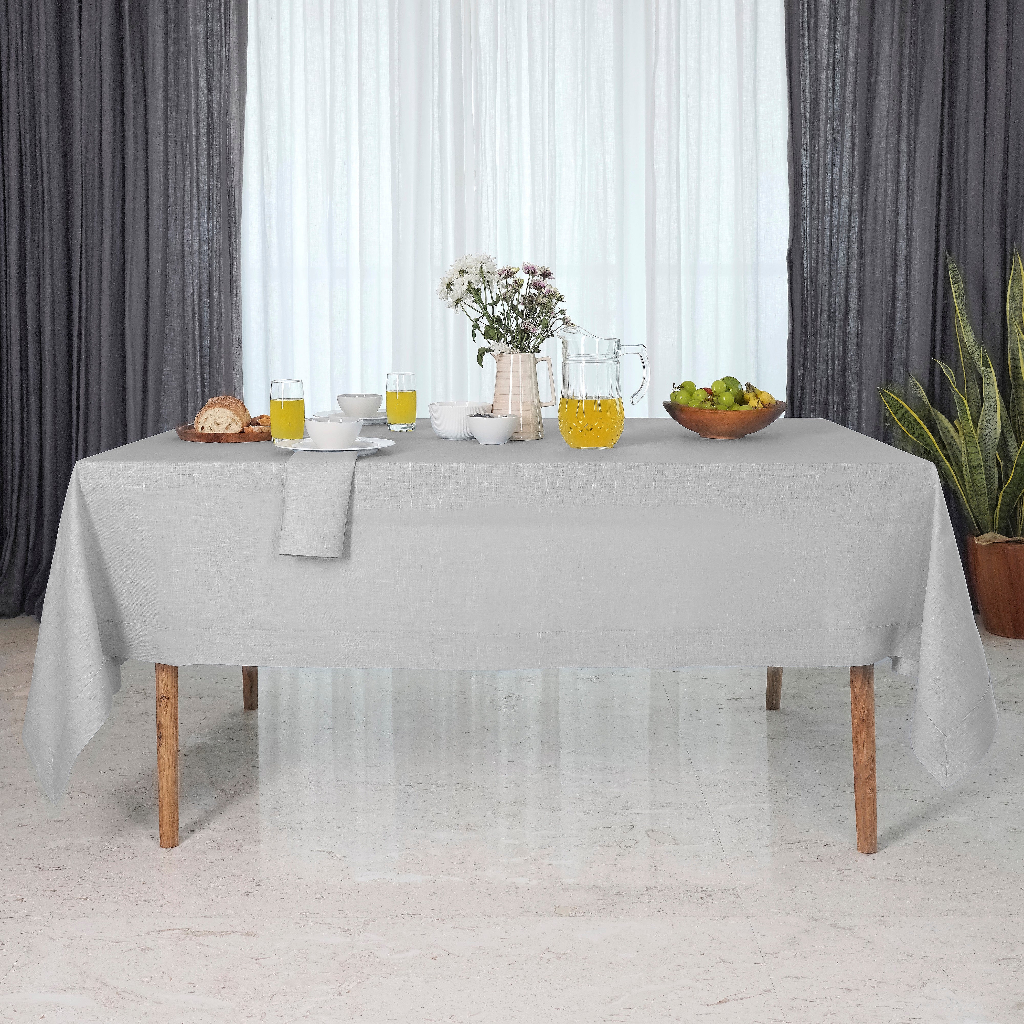 Close-up of the mitered corners on a silver grey pure linen tablecloth